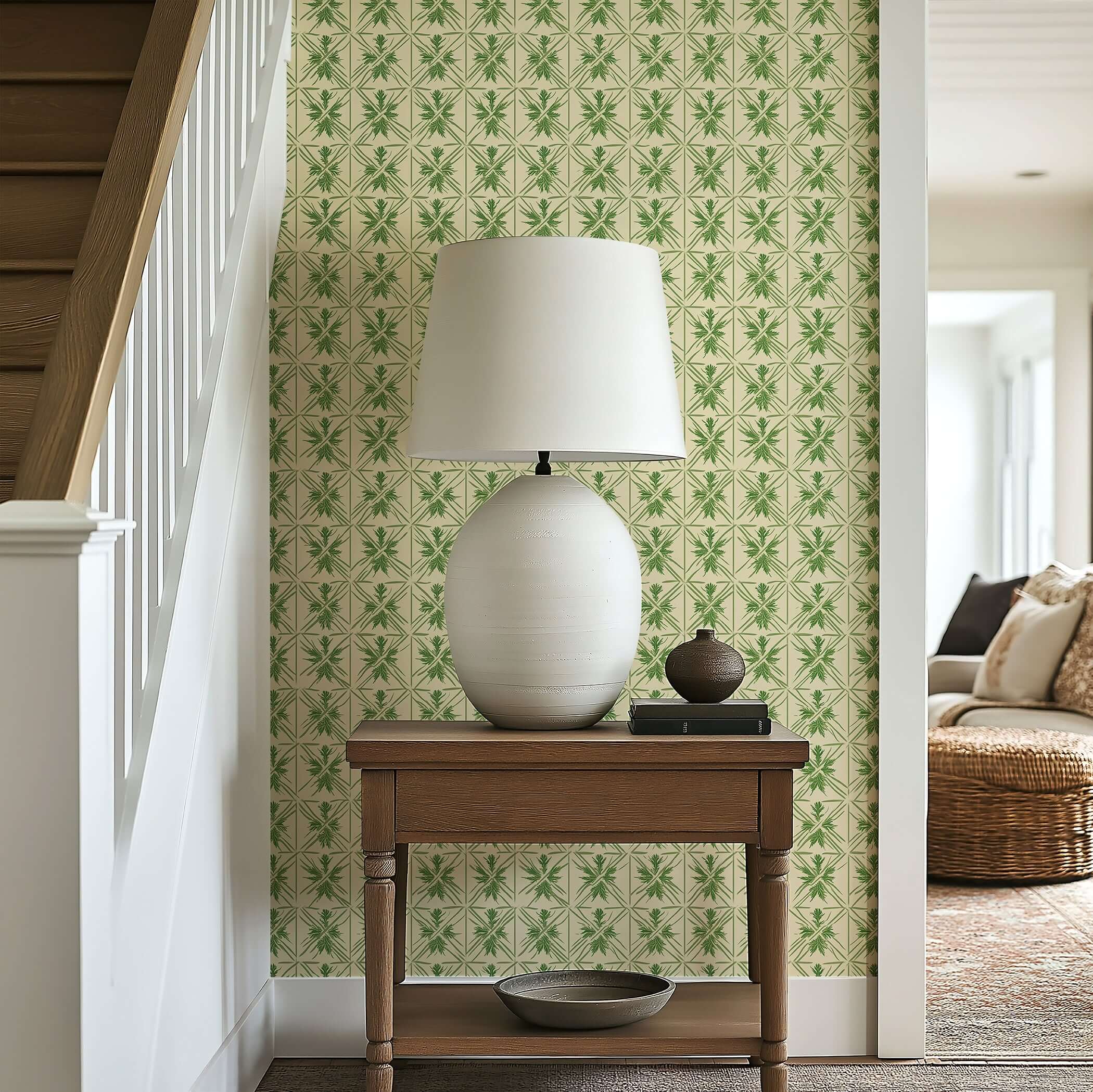 Entryway with geometric greenery wallpaper, featuring botanical patterns, a white table lamp on wooden table.