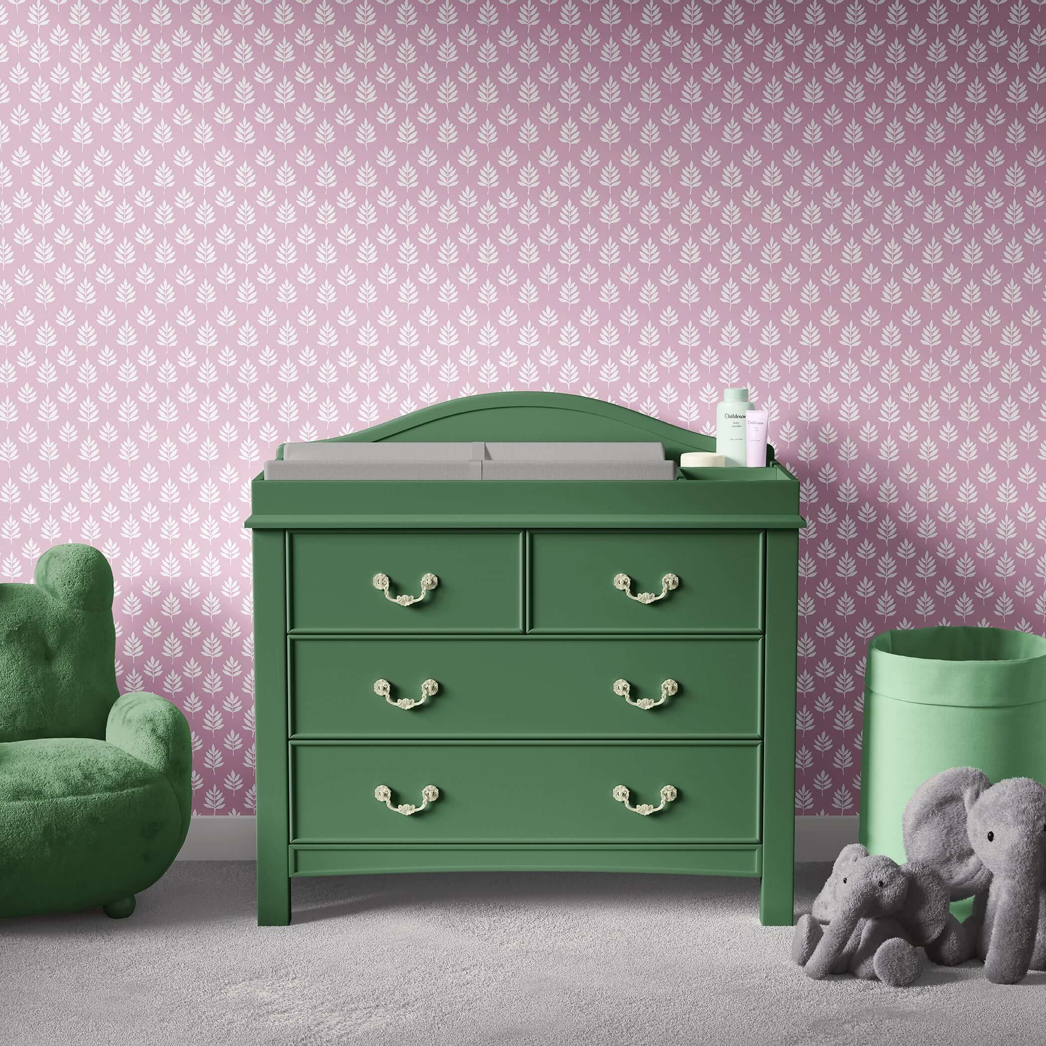 Gentle Leaves wallpaper featuring white leaf pattern on mauve-pink, ideal for modern nurseries with green furniture and plush toys.