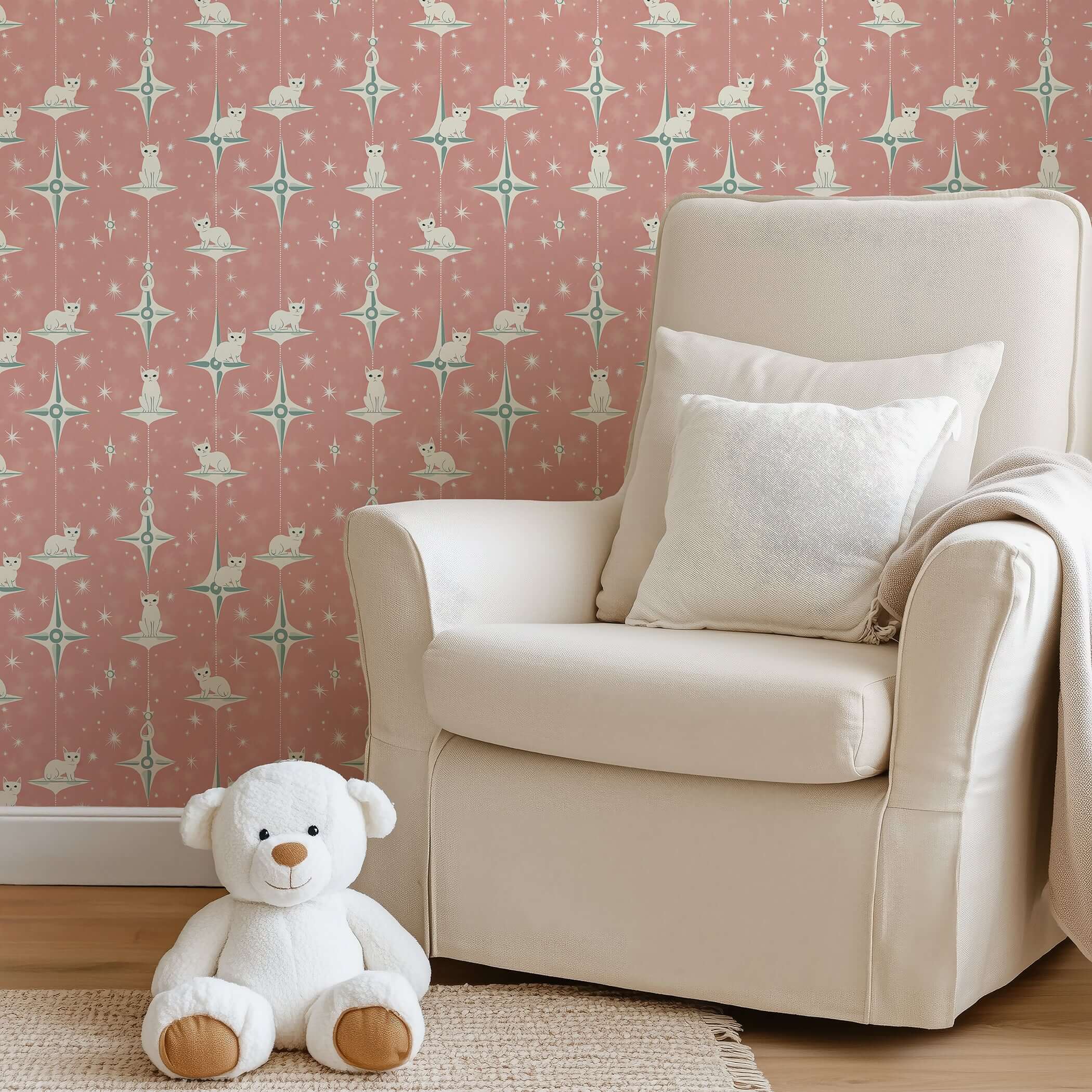 Cozy room with retro-style "Starry Kitties" wallpaper featuring white cats and starbursts, perfect for nurseries and playrooms.