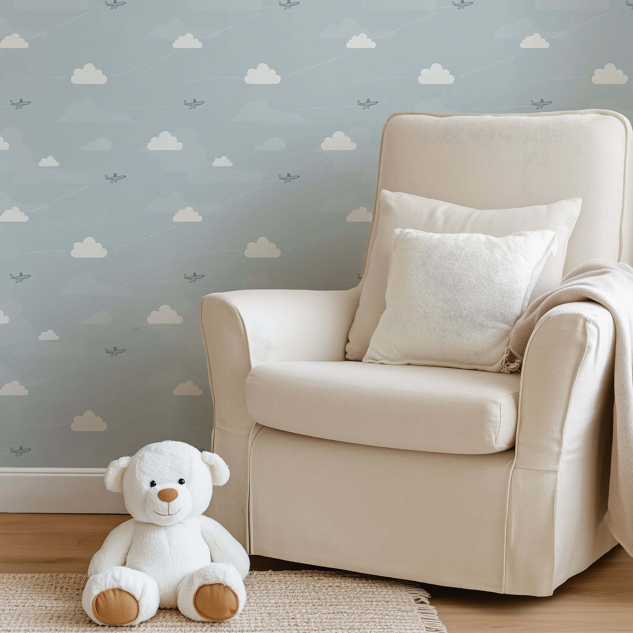 Light blue nursery with Flying High wallpaper featuring airplanes and clouds, perfect for children's room, nursery, or playroom.
