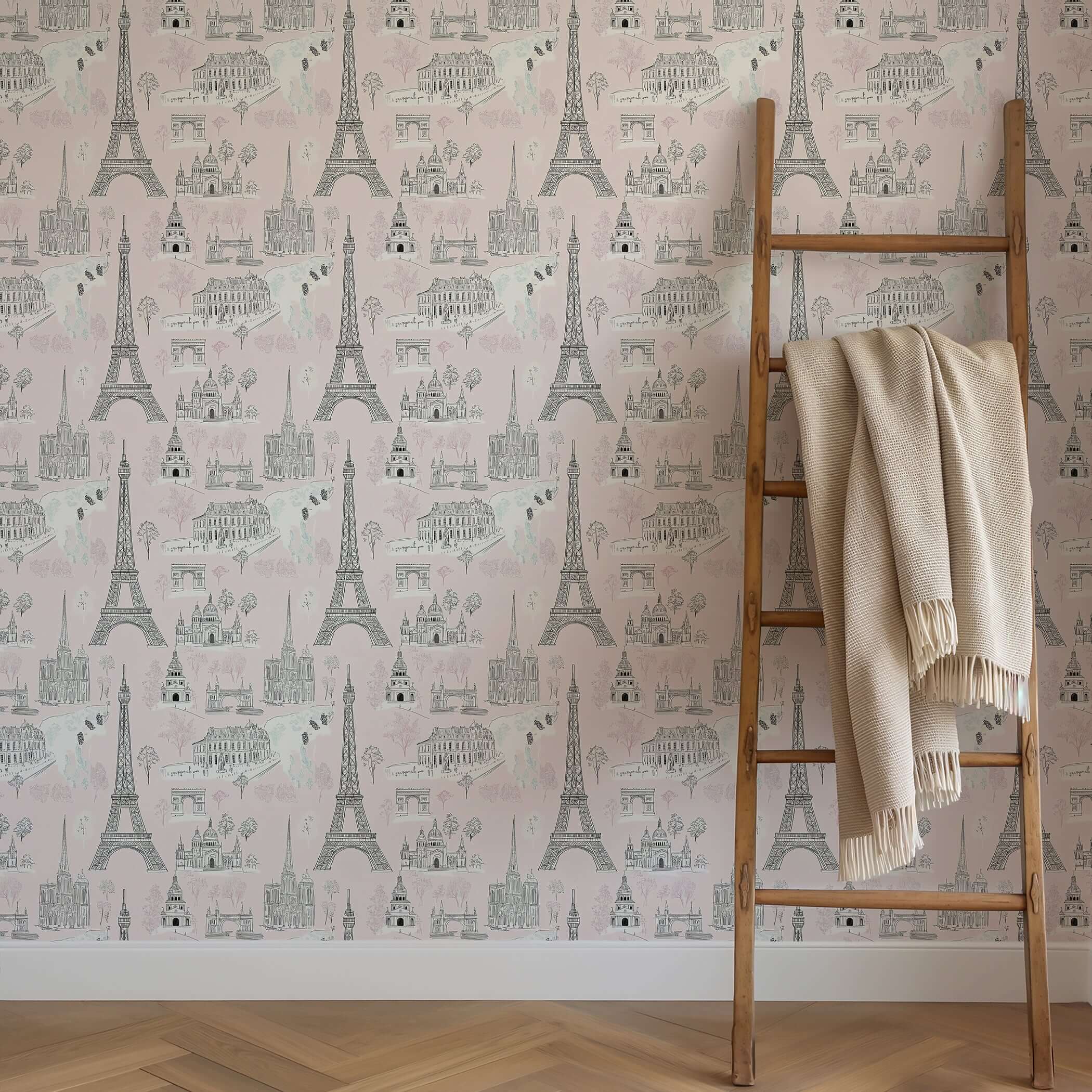 Dreaming of Paris wallpaper with Eiffel Tower, Arc de Triomphe, and Notre Dame on pink toile design for nursery or playroom décor.