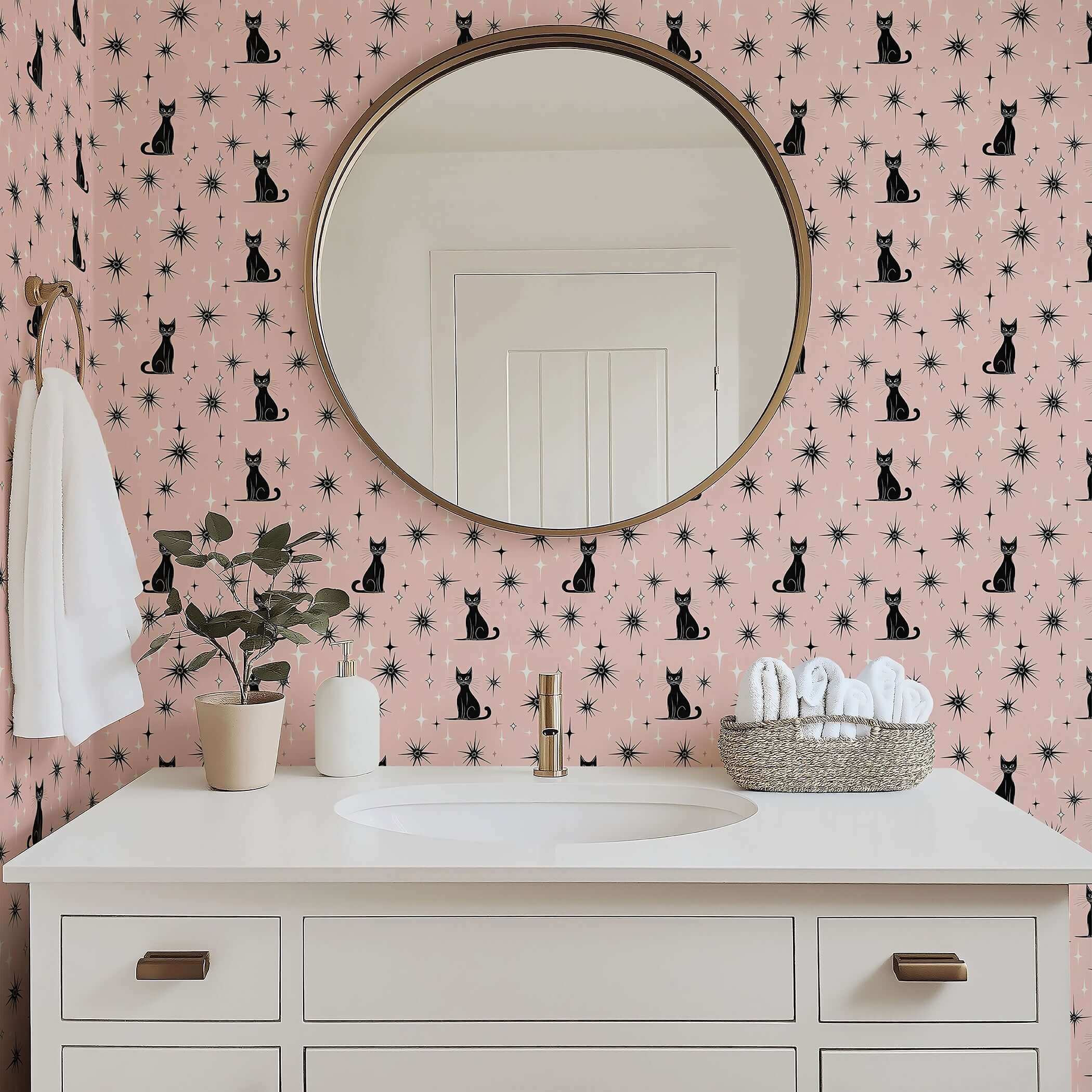 Twilight Catscape wallpaper featuring black cats and stars on blush, perfect for a mid-century modern nursery or playroom.