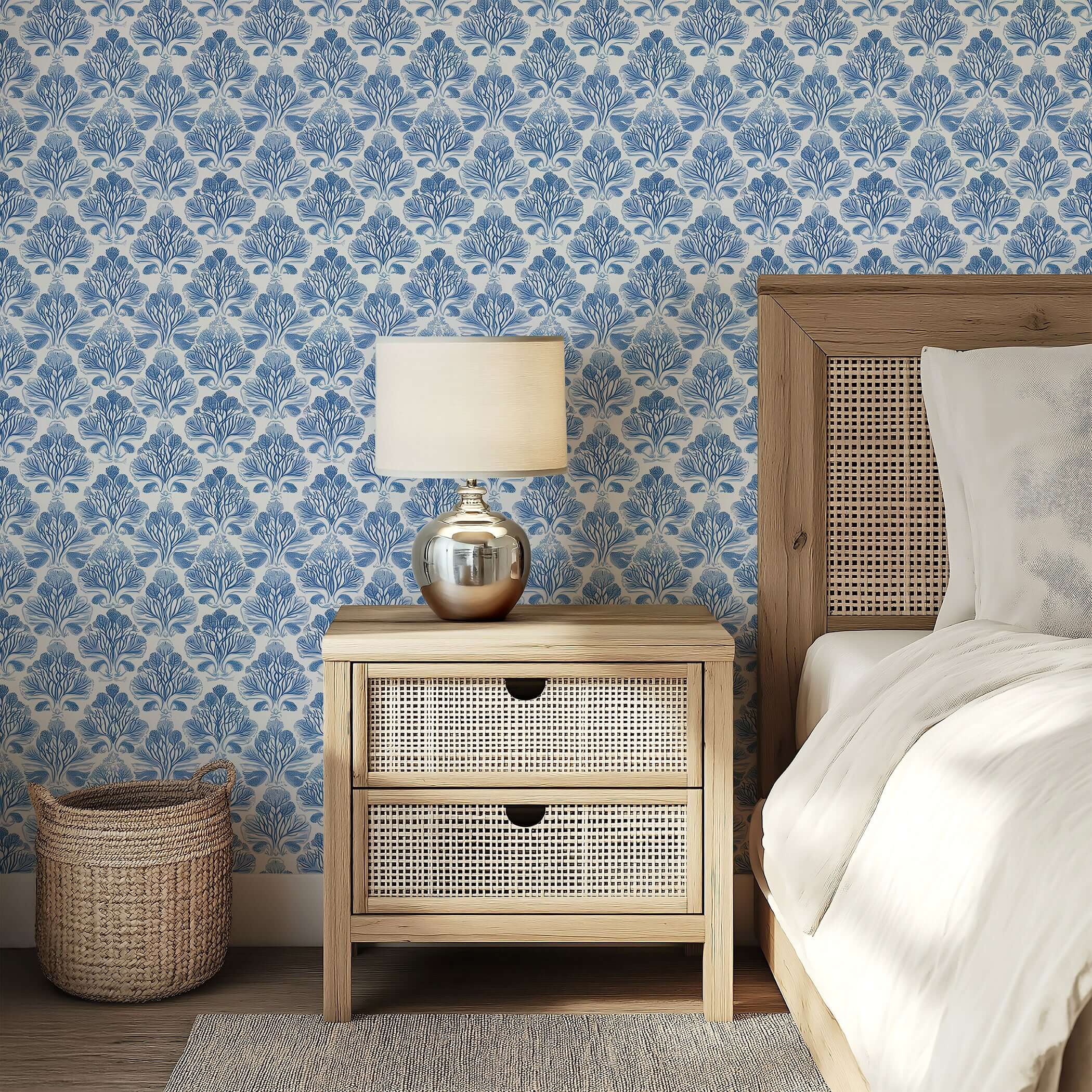 Coastal Luxe Coral wallpaper featuring blue coral damask pattern enhances a coastal-themed bedroom with soothing ocean-inspired decor.