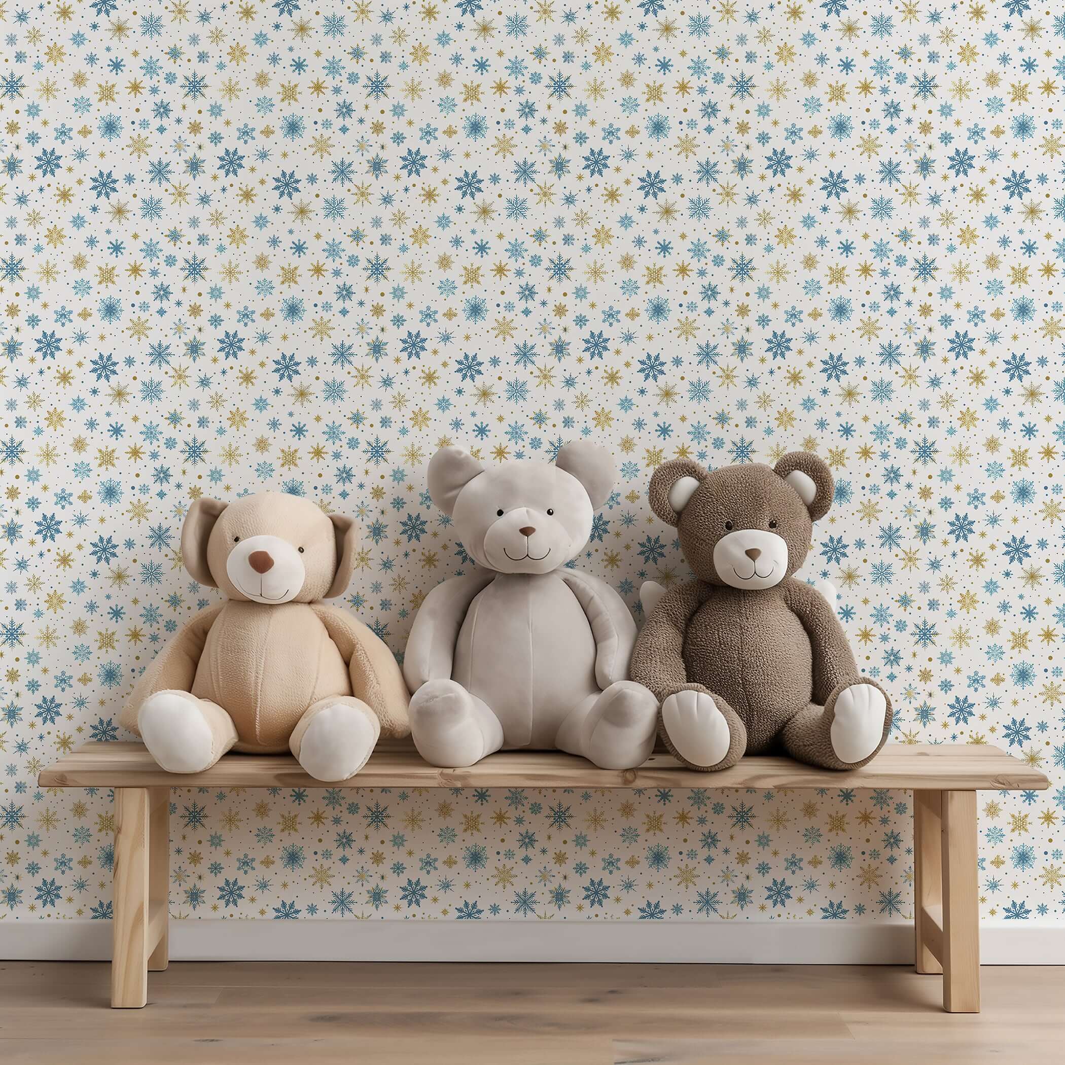 Mid-century modern wallpaper with gold and blue snowflakes, perfect for holiday decoration, behind plush toys on a wooden bench.