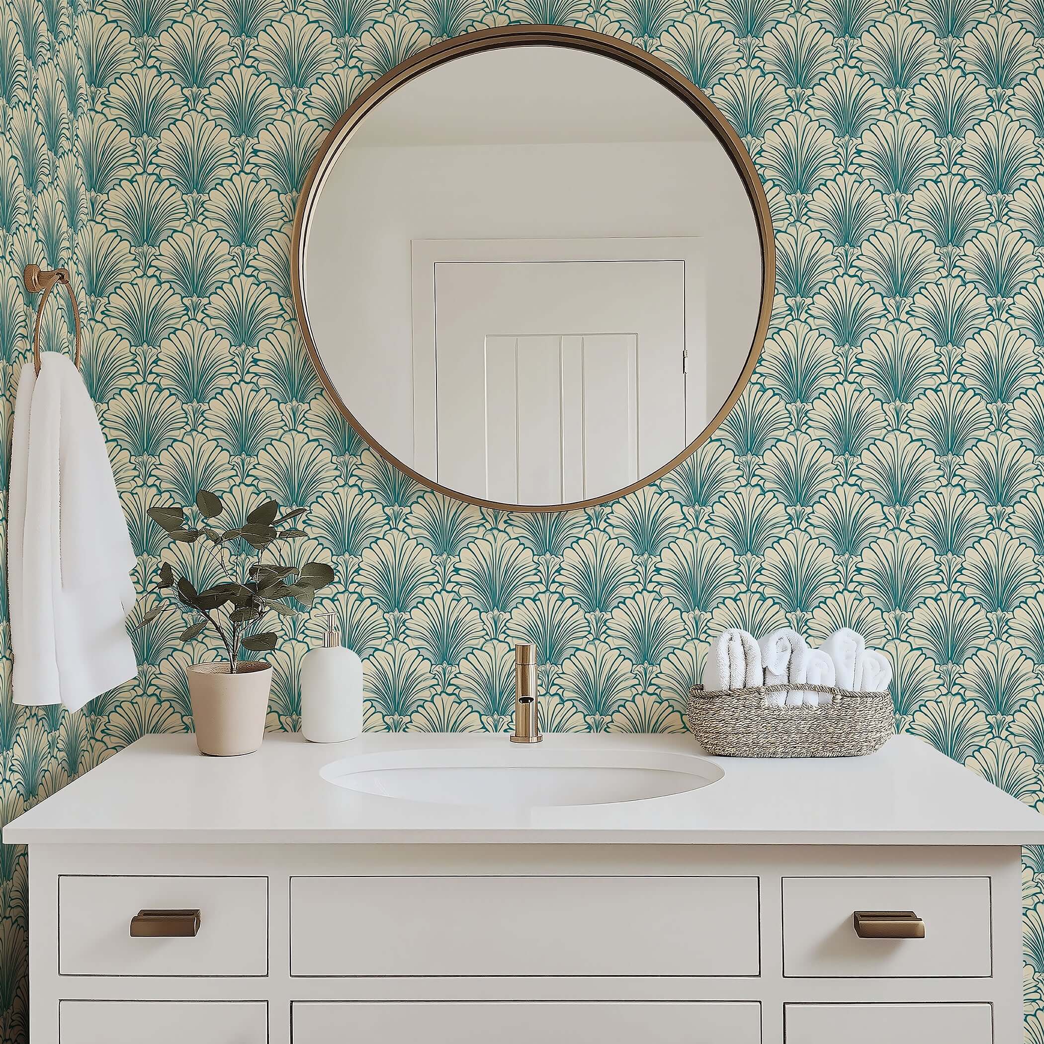 Art Deco bathroom with teal and tan coastal wallpaper featuring scallop motifs, complementing modern white vanity and circular mirror.