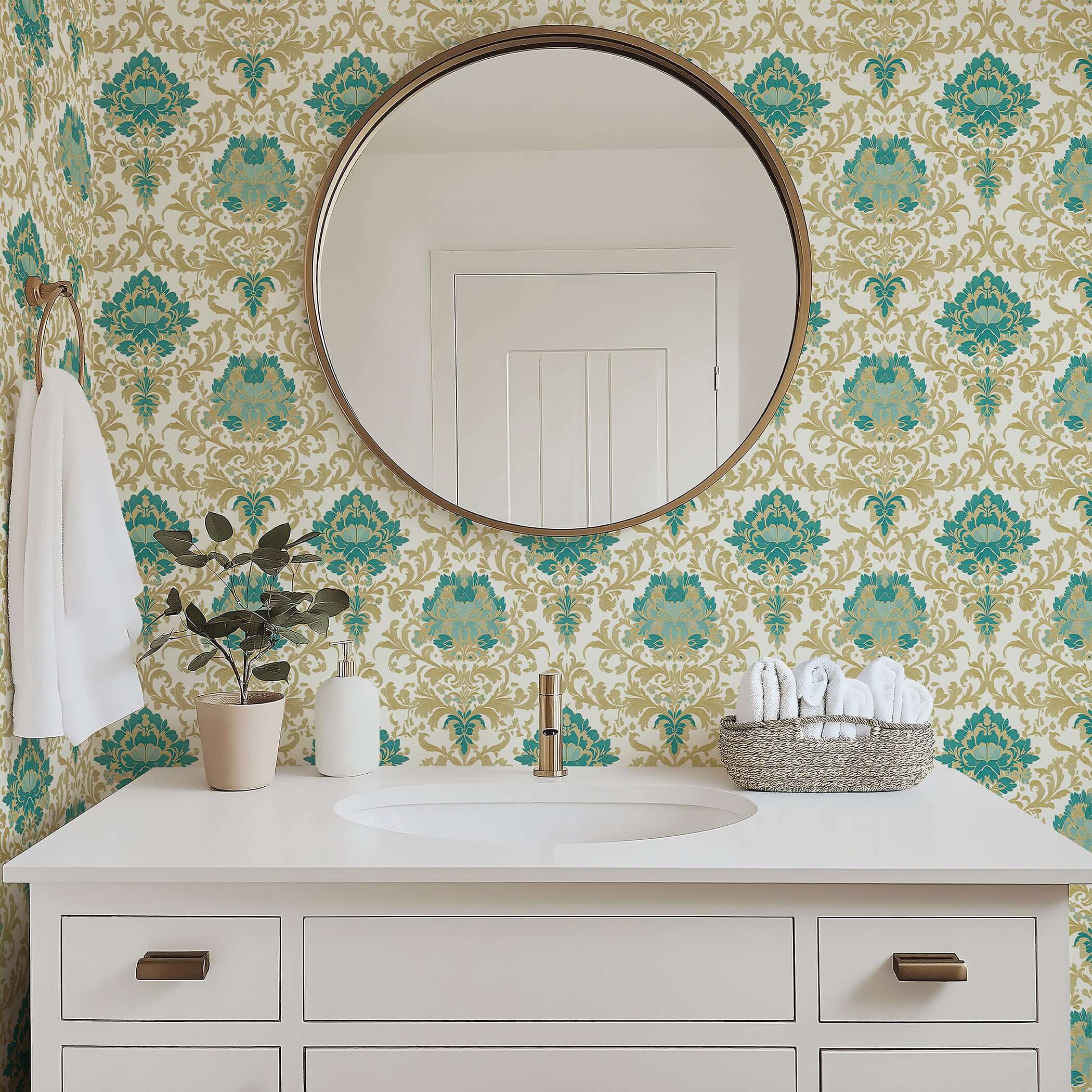 Bathroom with teal and gold damask wallpaper, white vanity, round mirror, and decorative plant, exuding timeless elegance.