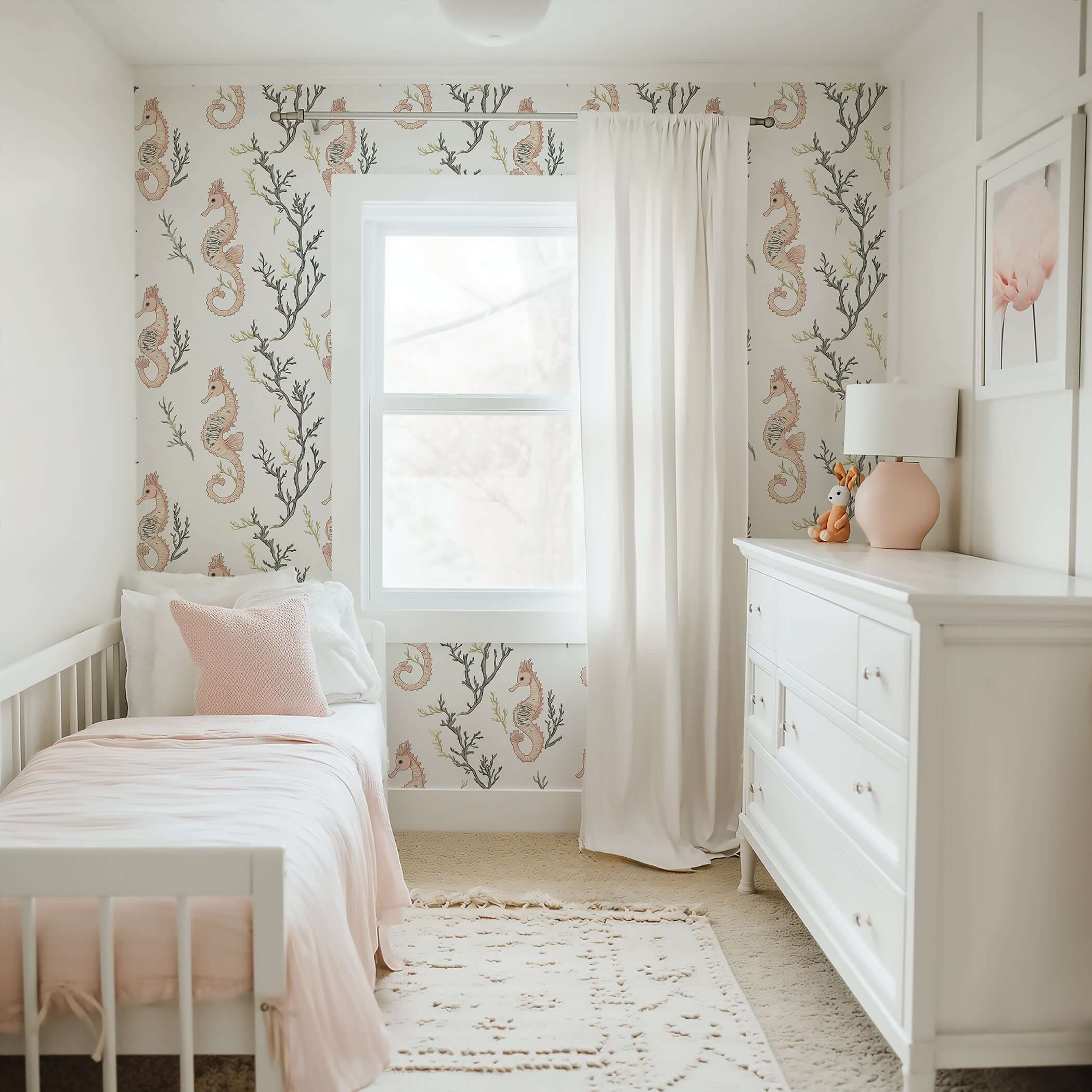 Coastal nursery with 'Seahorse Serenity' wallpaper featuring seahorses, coral, and seaweed design, creating an airy marine ambiance.