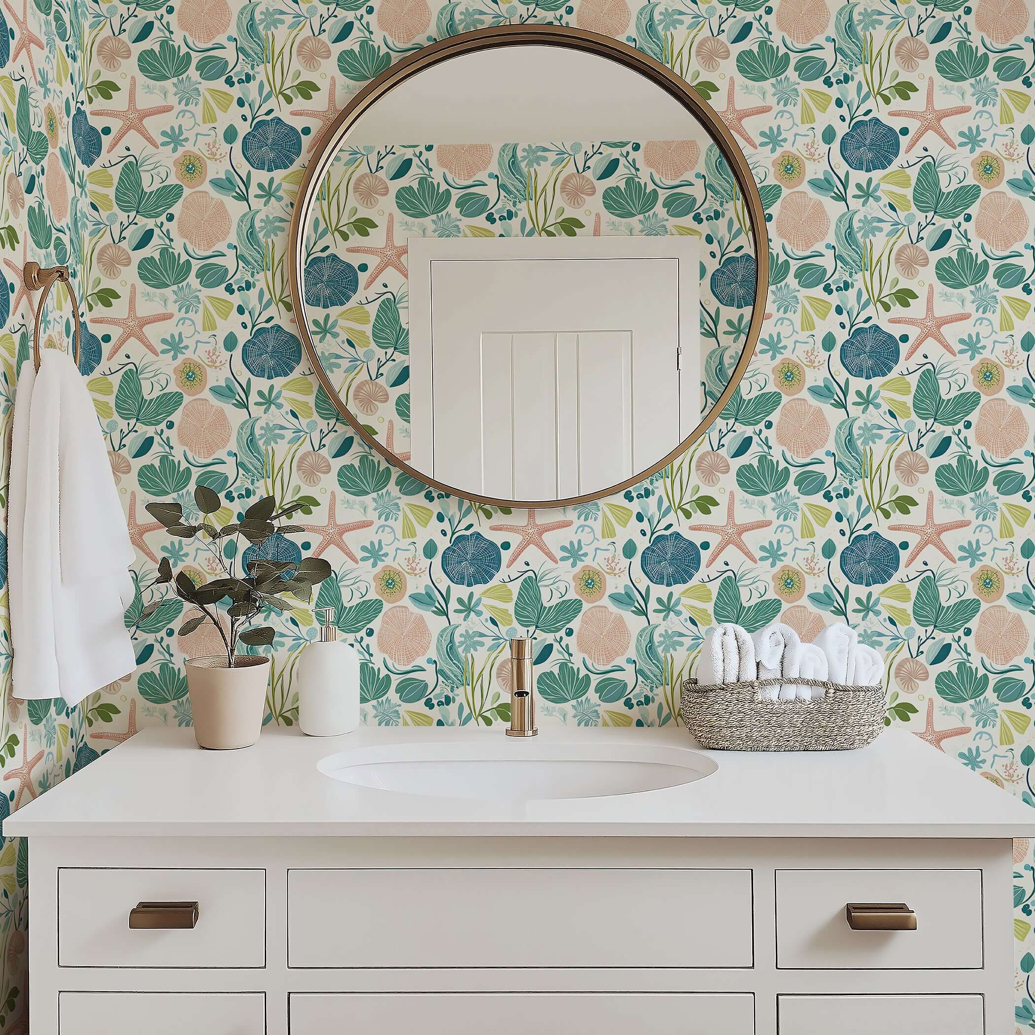 Bathroom with Tidepool Treasures coastal wallpaper featuring ocean motifs like coral, seaweed, and starfish for serene beach vibes.