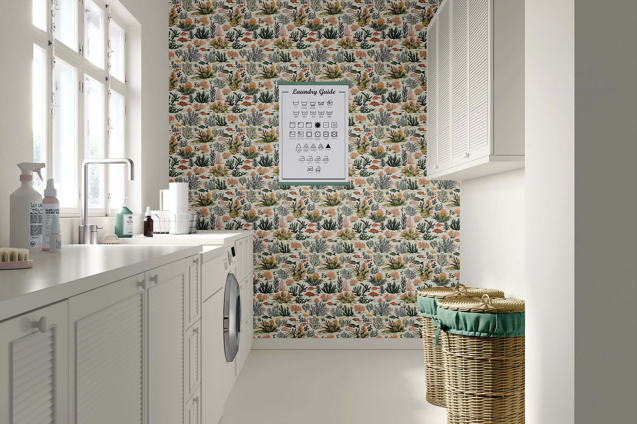 Coastal wallpaper with tropical fish, coral, and seaweed in a modern design for ocean-themed spaces, featured in a laundry room.