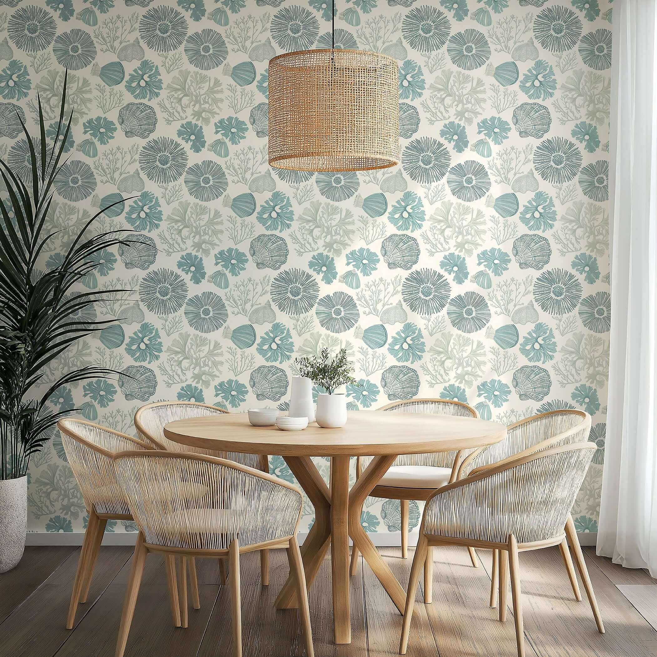 Coastal wallpaper with seashells and coral design in soft blue tones, perfect for beach-themed rooms. "Shoreline Charm" elegance by Wall Artifacts.