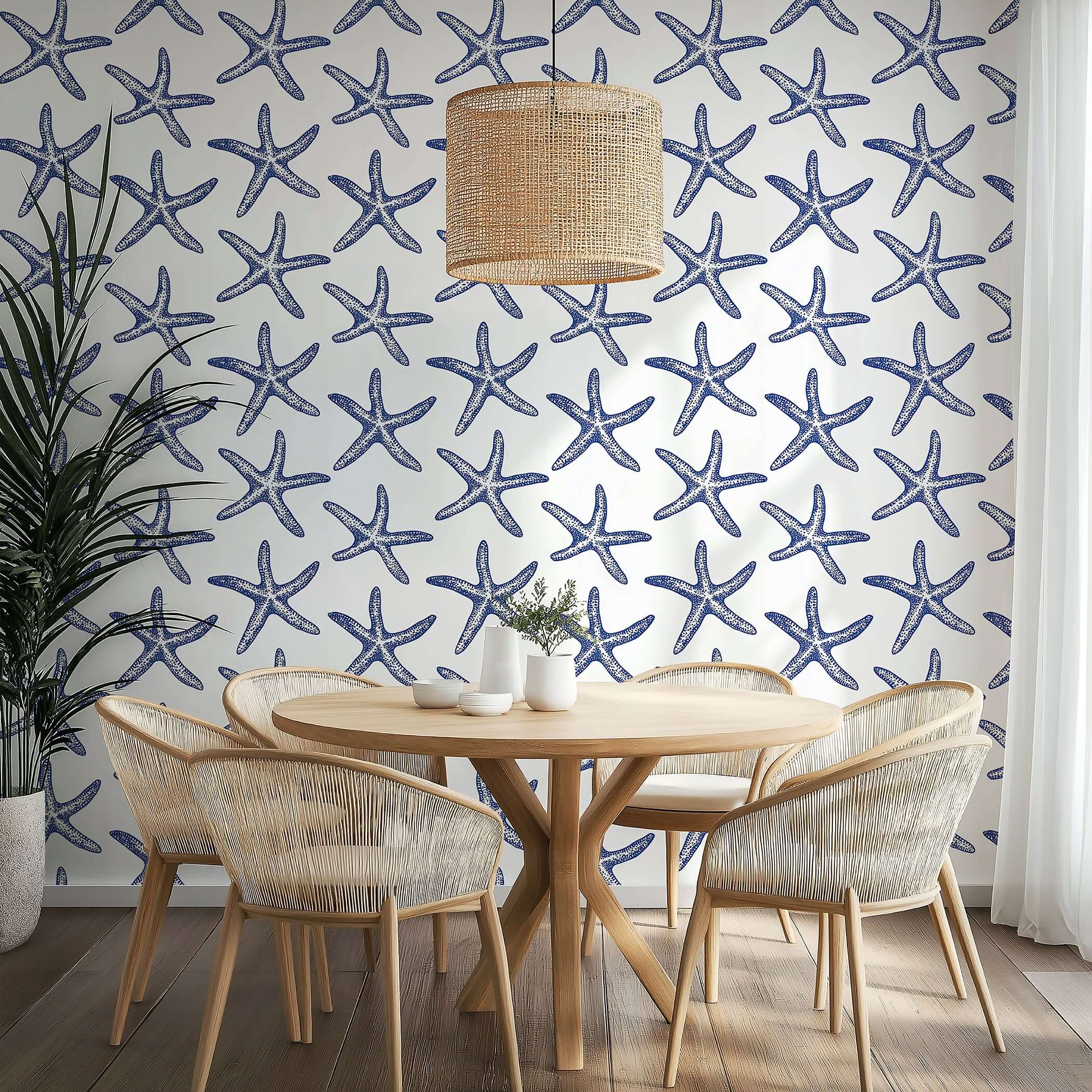 Modern coastal wallpaper with blue starfish pattern, perfect for beach-themed rooms. Enhance your space with seaside charm.