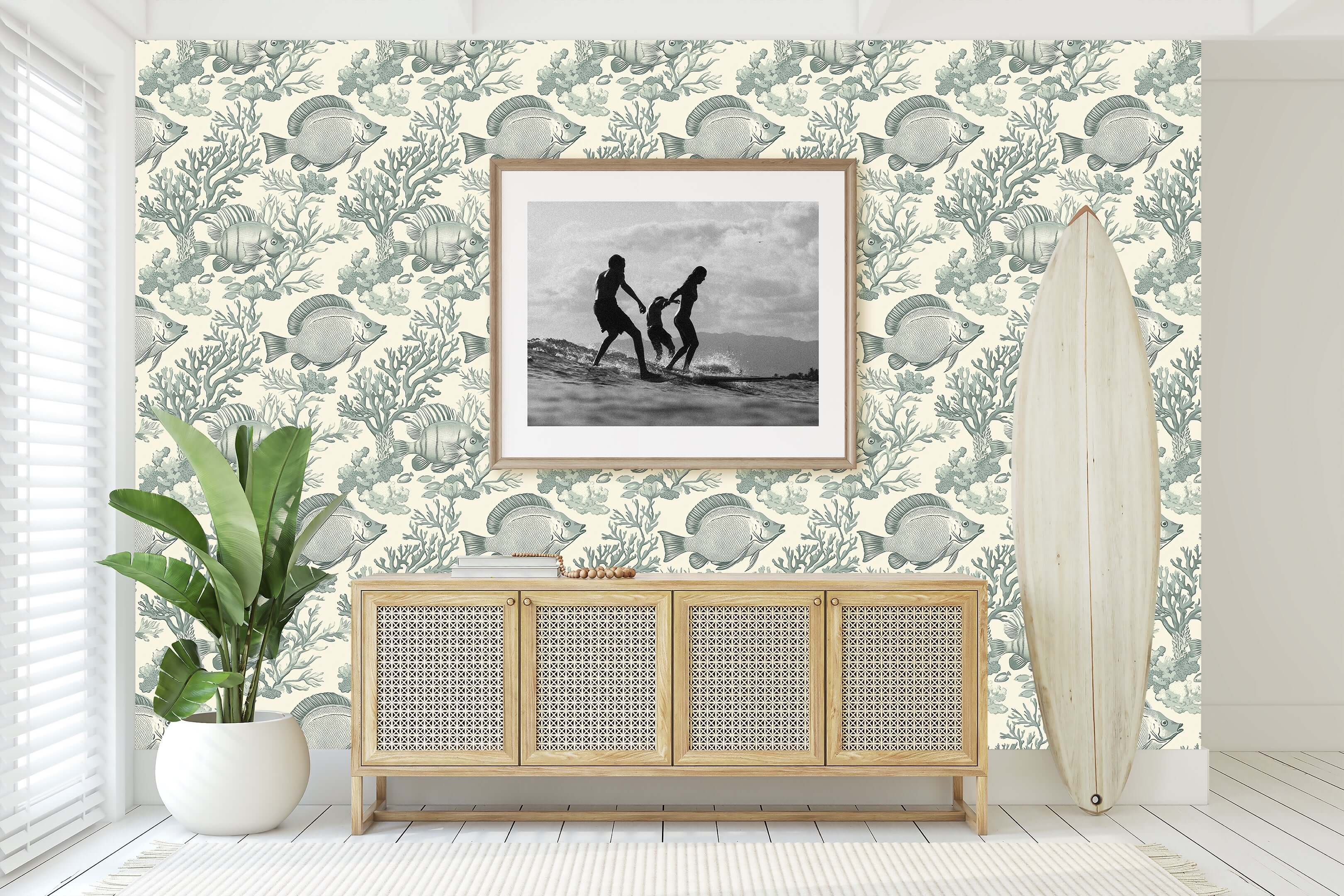 Elegant coastal wallpaper with vintage fish design enhancing a beach-themed room, featuring surfboard and framed picture.