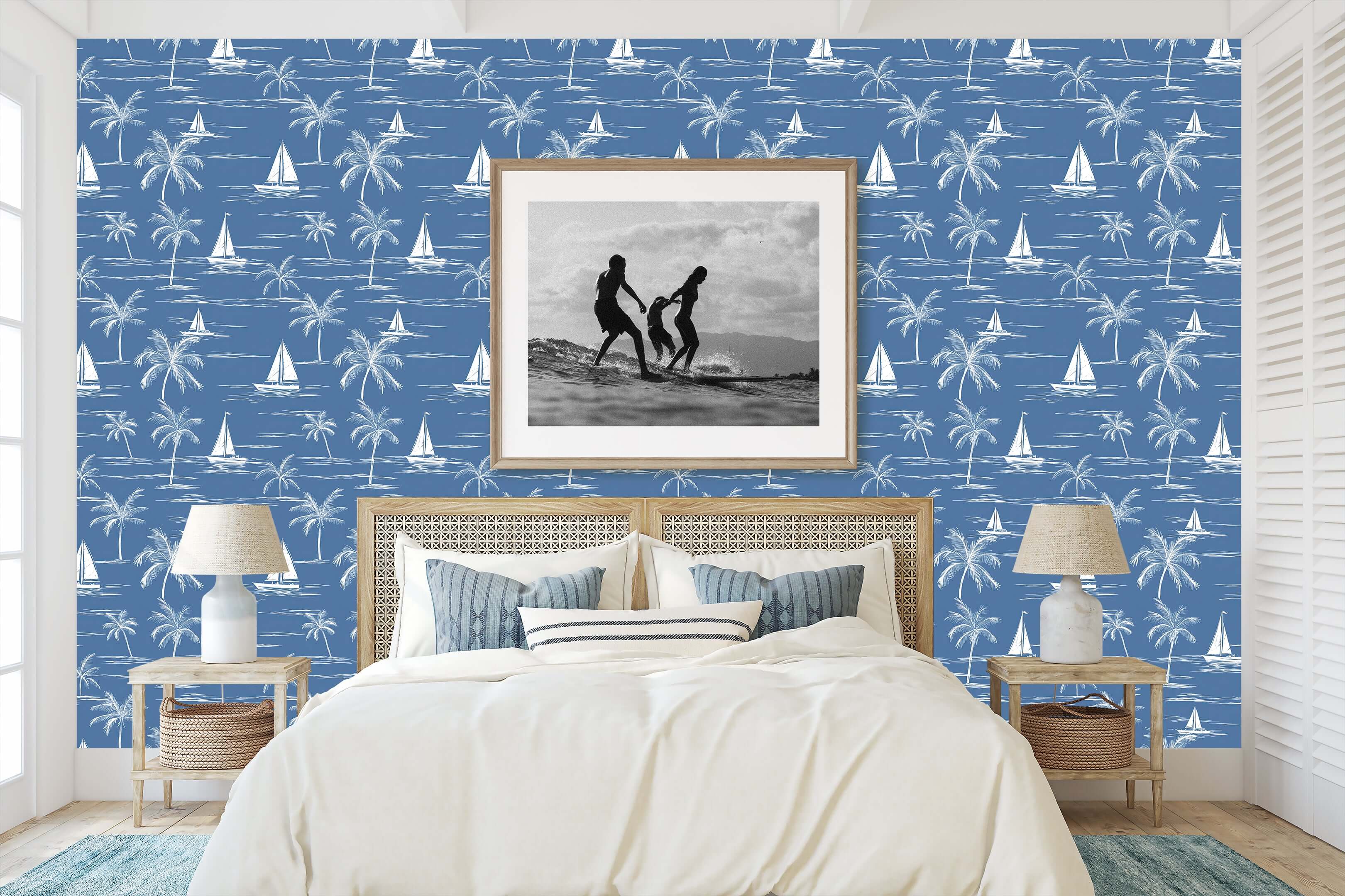 Coastal bedroom with Sail and Palm wallpaper featuring toile design of sailboats and palm trees on a blue backdrop, ideal for beach decor.
