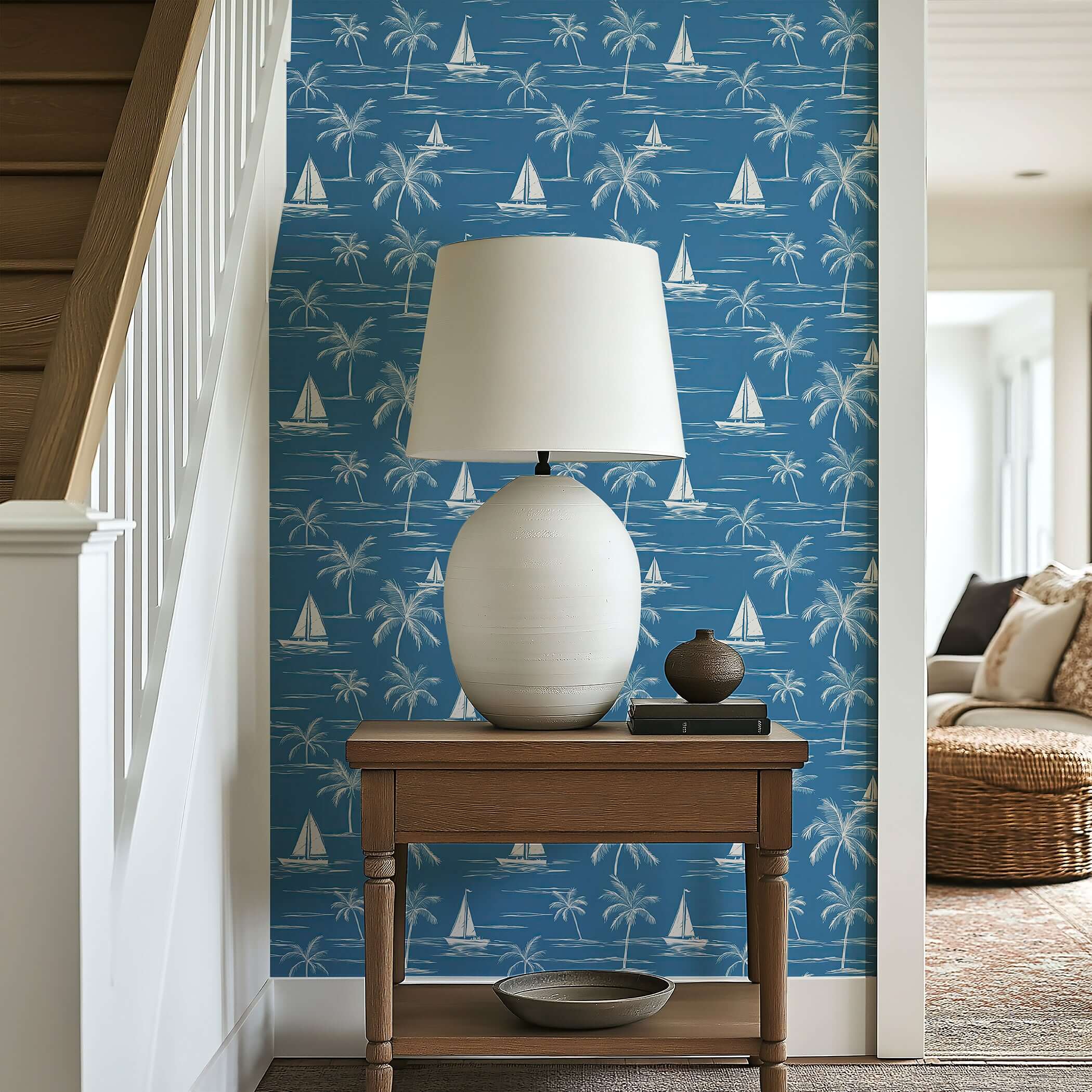 "Sail and Palm" wallpaper featuring sailboats and palm trees in a blue oceanic design, adding coastal charm to interior decor.