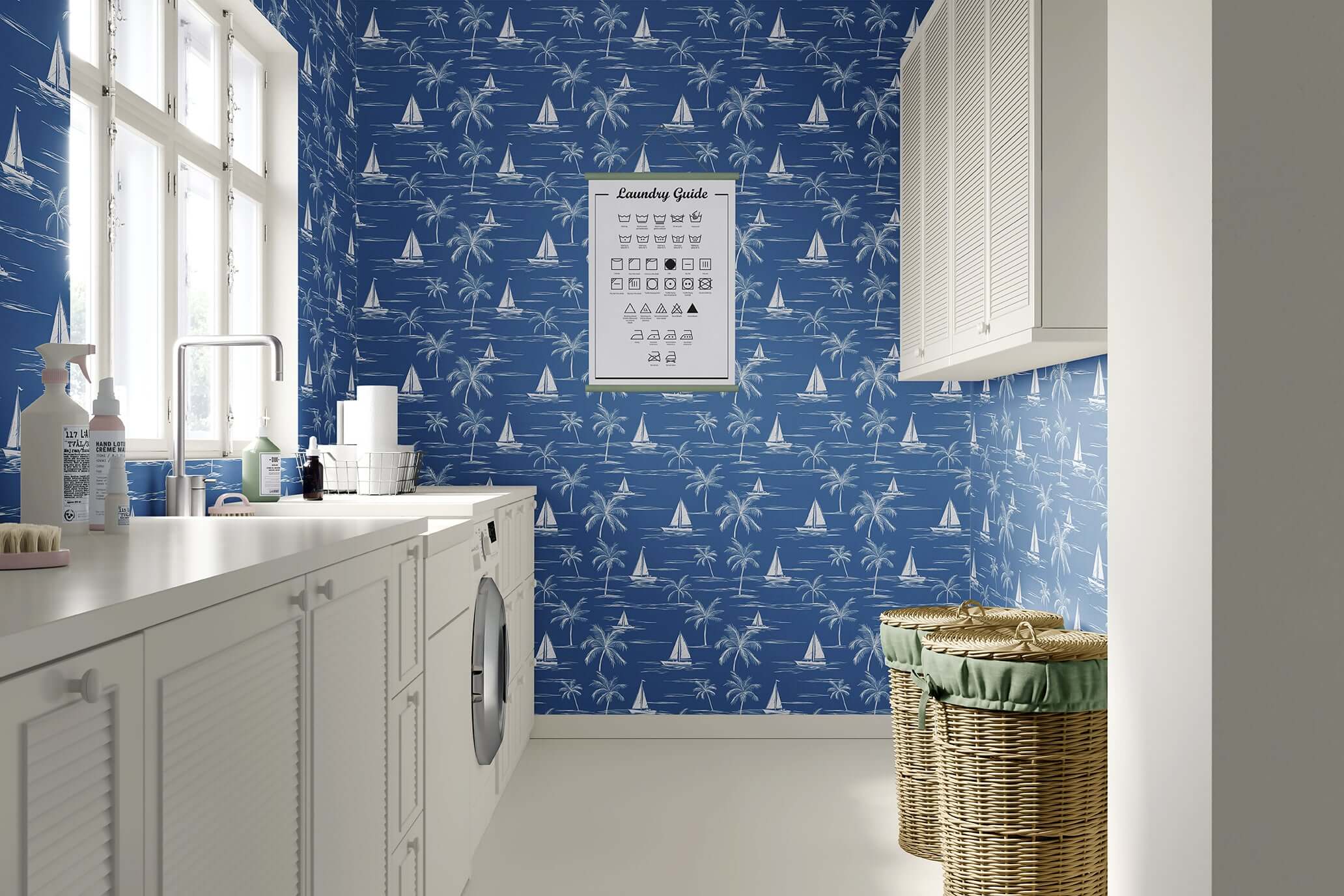 Laundry room with "Sail and Palm" wallpaper featuring toile-style sailboats and palm trees in a coastal design on deep blue walls.