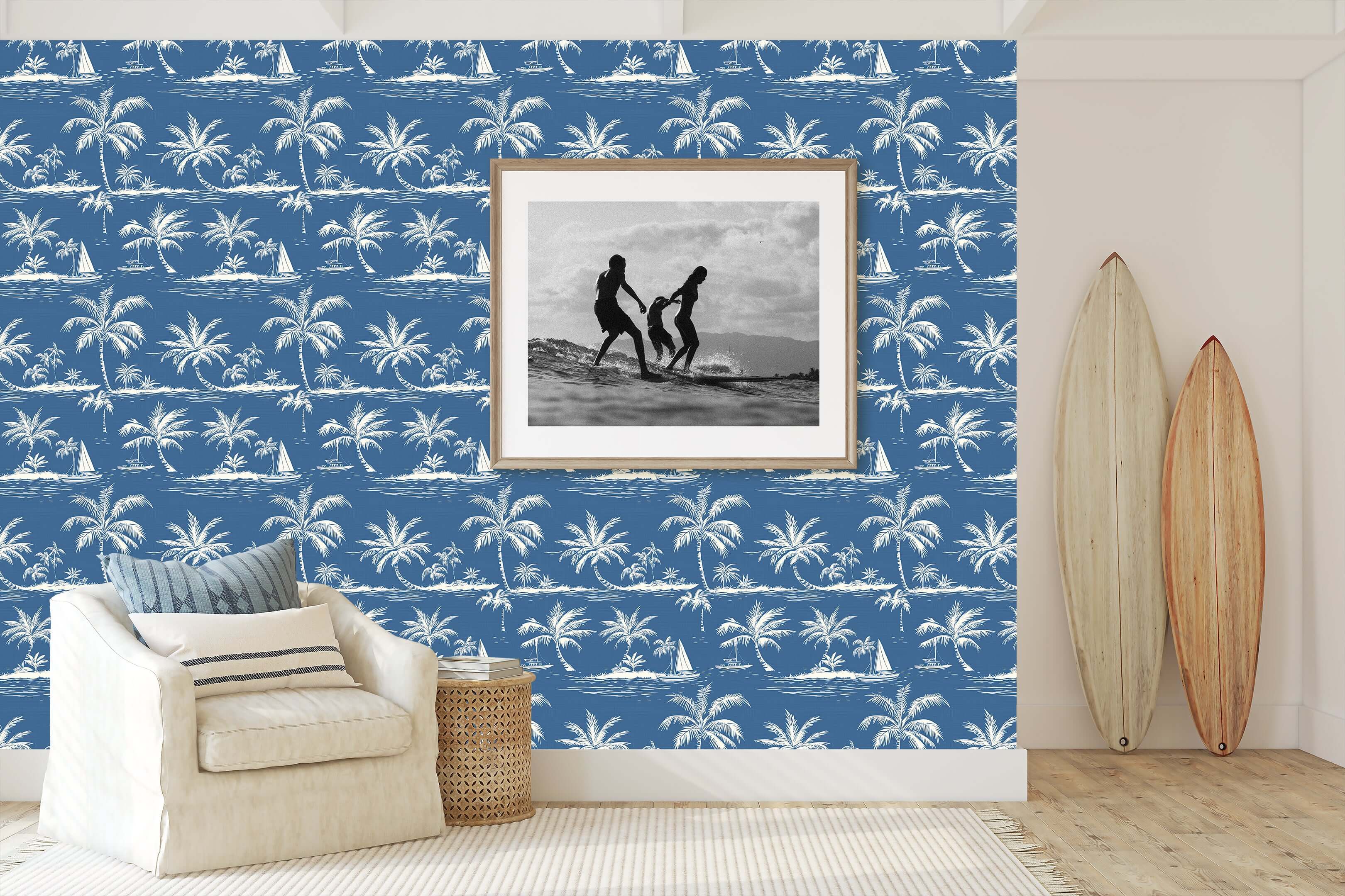 Blue Hawaii wallpaper with hand-drawn palm trees and boats on ocean-blue background, perfect for coastal and beach-inspired interiors.