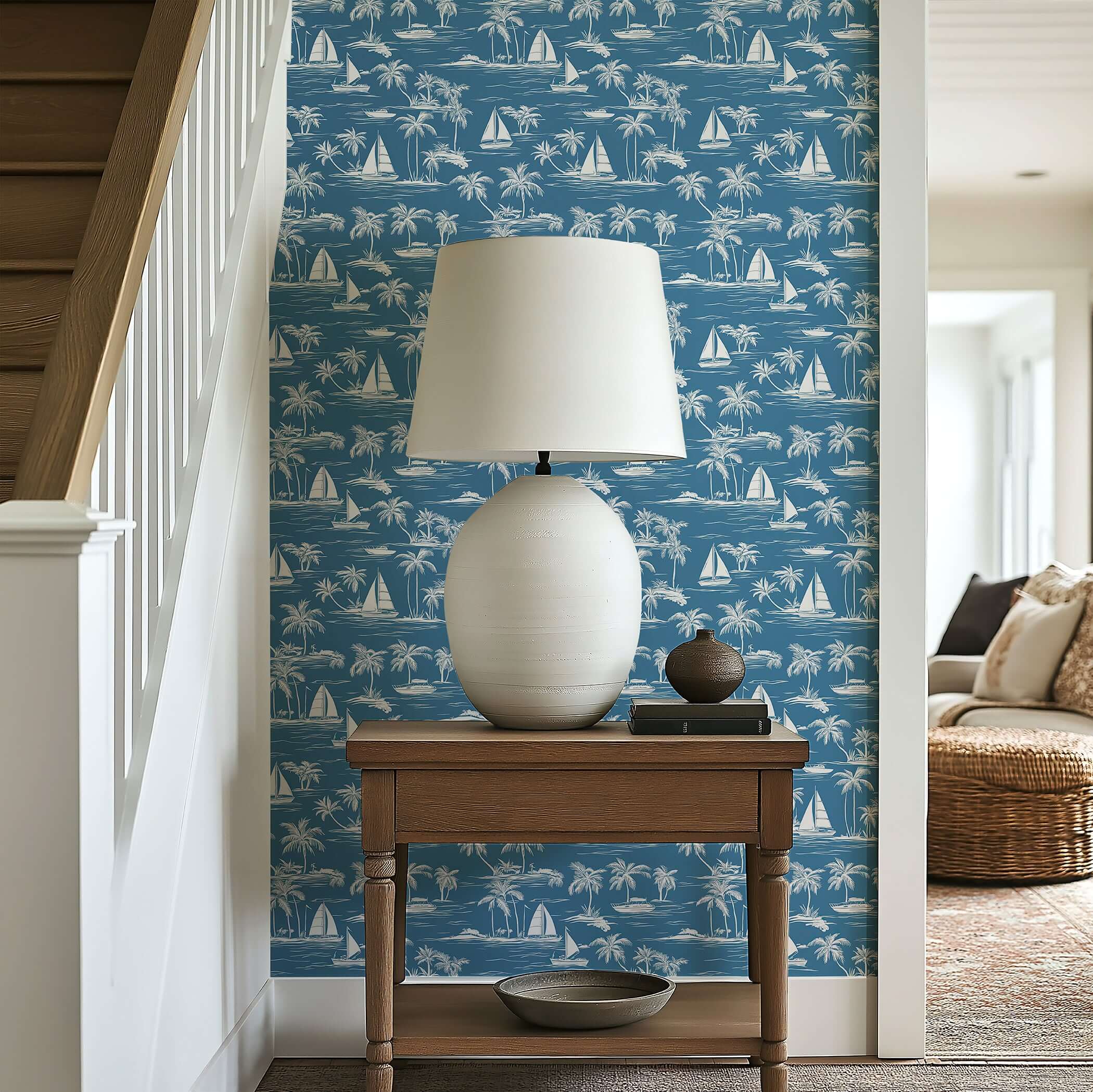 Toile "Sail Away" coastal wallpaper with sailboats and palm trees enhancing a nautical-themed room with serene, elegant design.