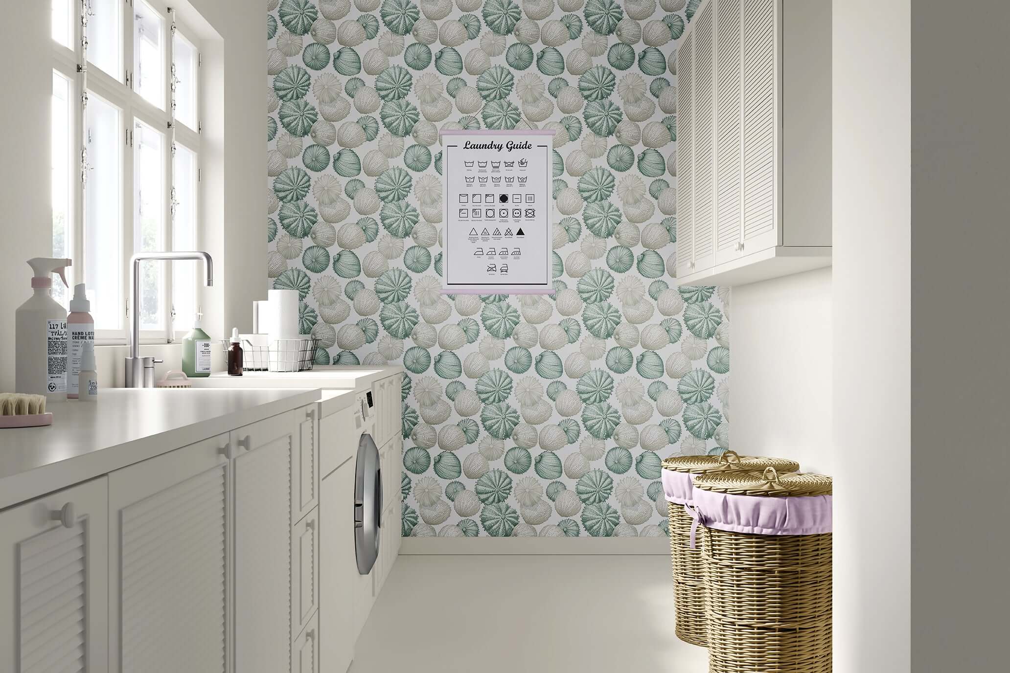 Bright laundry room featuring "Ocean Jewels" wallpaper with sea urchins and seashells in soft green, cream, and blue tones for a coastal vibe.