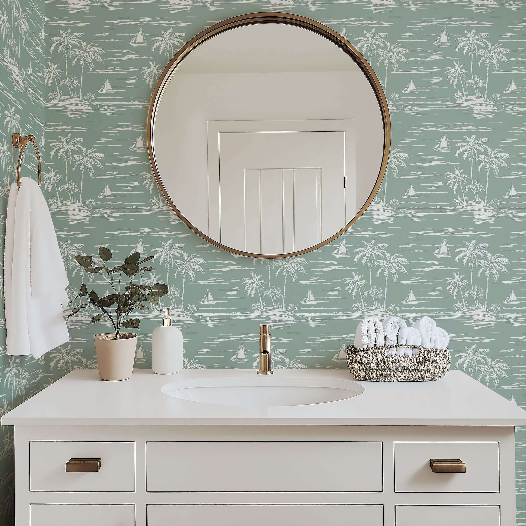 Palm Coastline wallpaper featuring palm trees and sailboats in a coastal bathroom setting with a round mirror and white vanity.