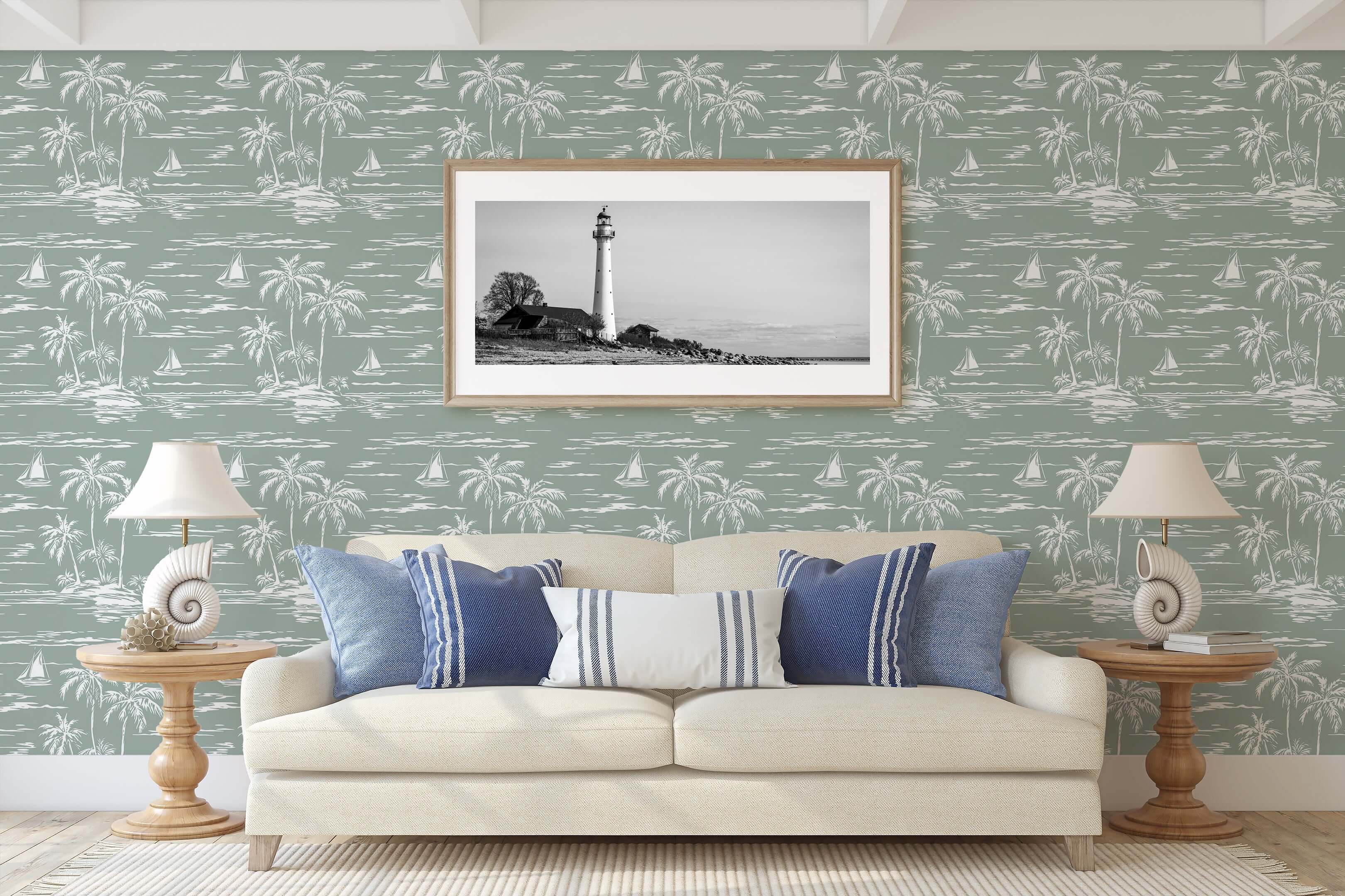 Coastal living room with Palm Coastline wallpaper featuring boats and palm trees in sage green, complementing beach-themed decor.