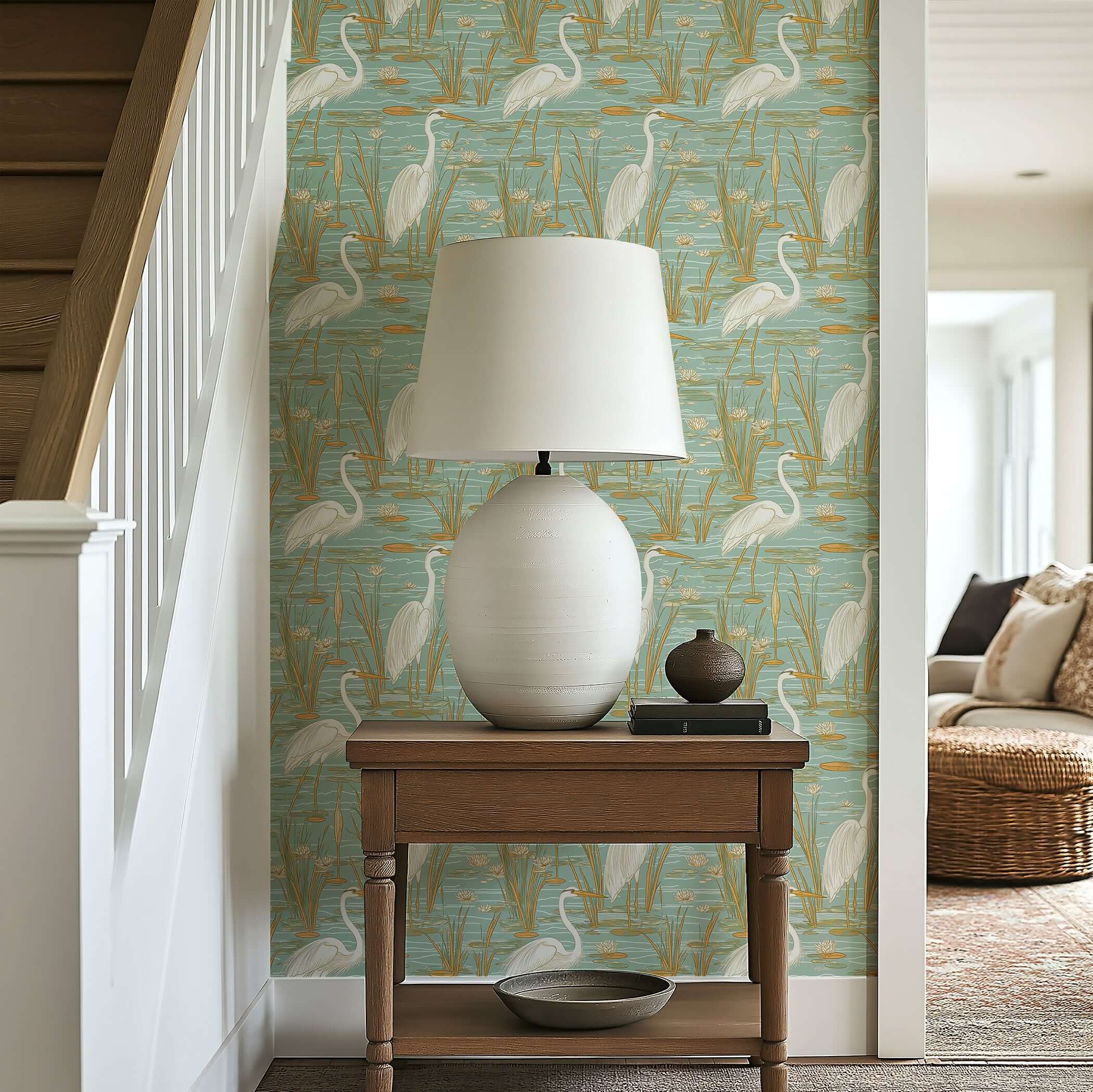Teal and tan coastal wallpaper depicting blue herons, lilies, and reeds, creating a tranquil marshland scene in a serene room setting.