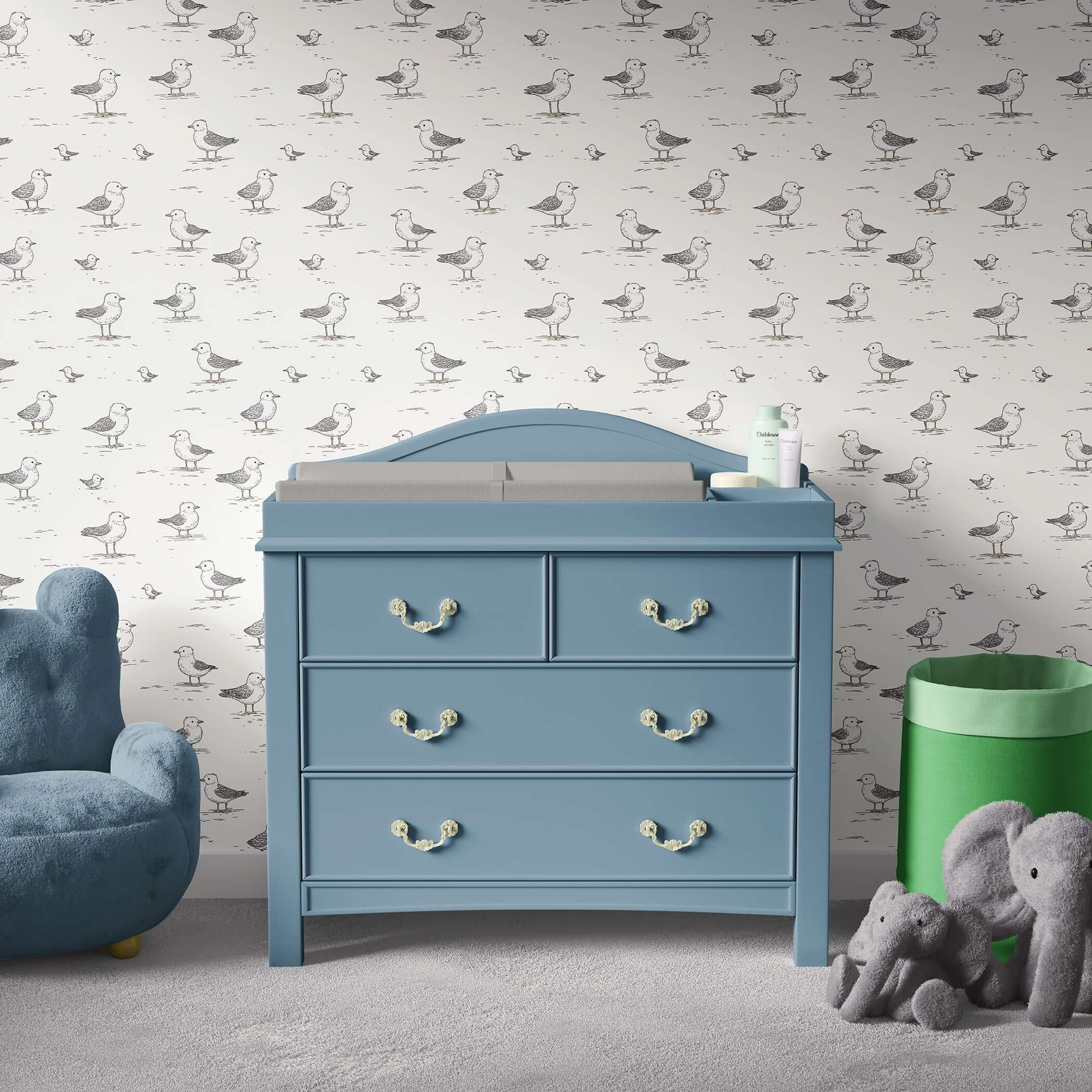 Charming nursery with "Seaside Seagull Friends" wallpaper featuring hand-drawn seagulls on cream, adding playful charm to modern decor.