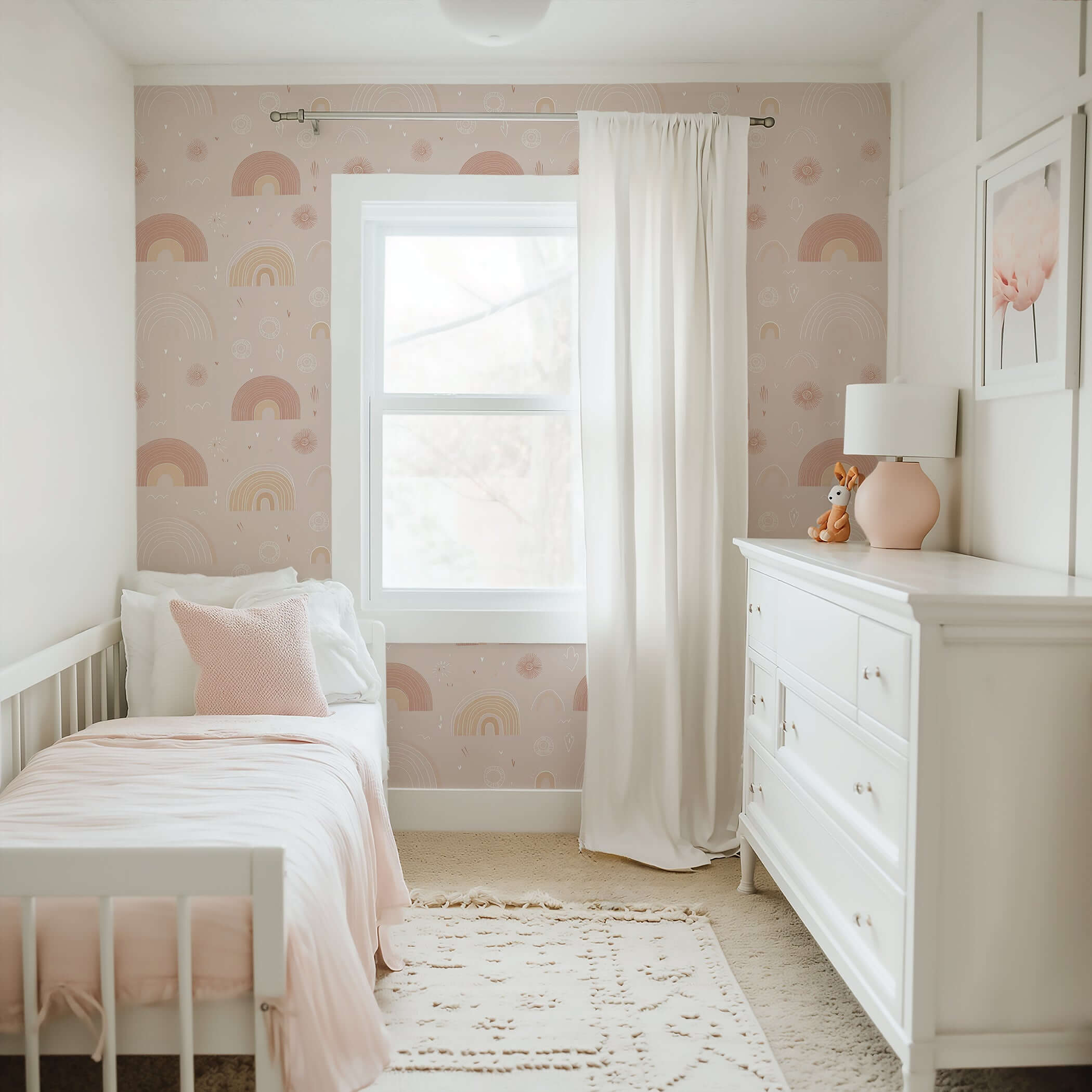 Nursery with pastel rainbow wallpaper featuring soft pink and beige colors, perfect for modern baby or children's room decor.