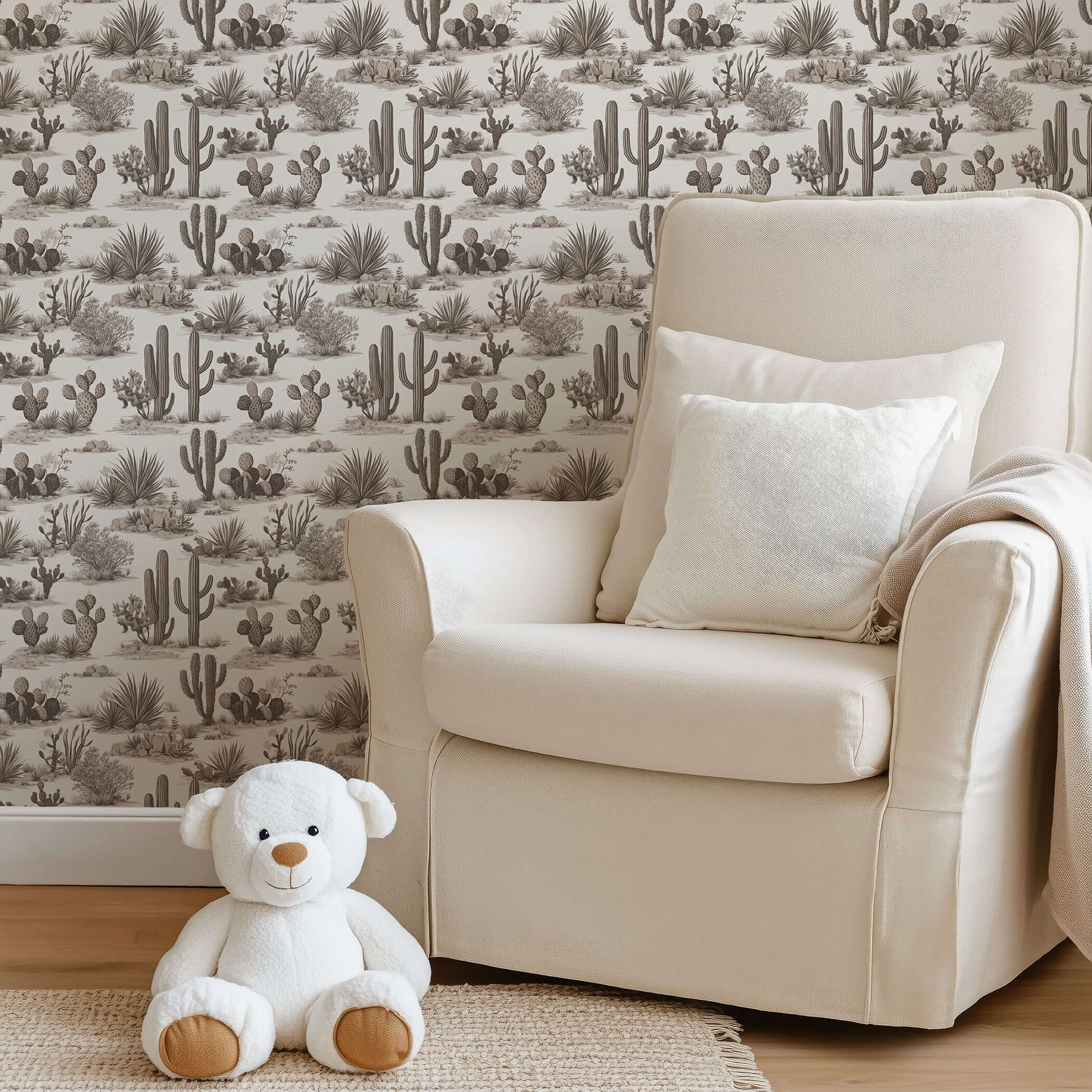 Desert Toile Elegance Wallpaper with hand-drawn cacti and succulents in a neutral palette, enhancing a cozy living room corner.