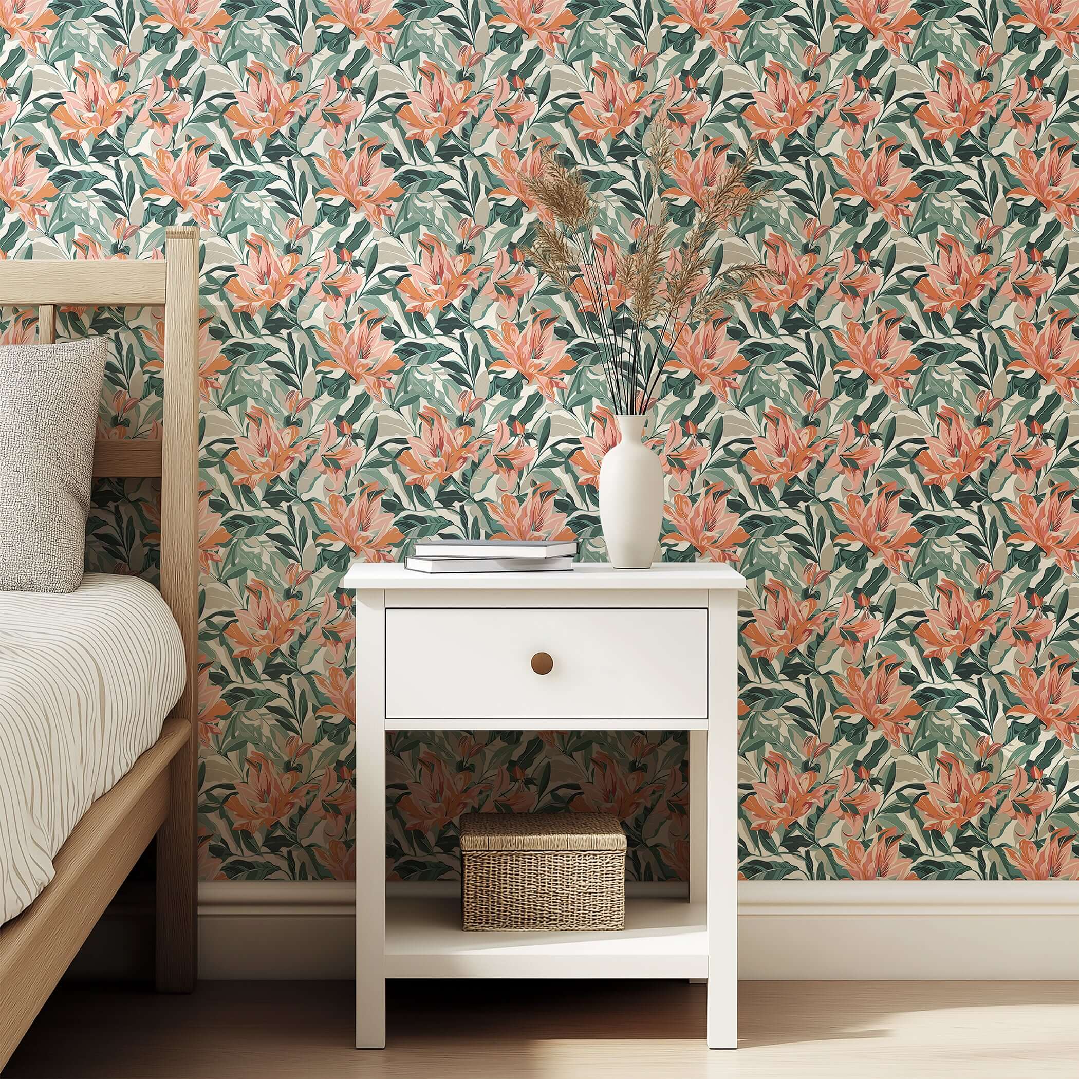 Sunlit Garden wallpaper with coral petals and green foliage, creating a tropical, coastal vibe in a bedroom with a nightstand.