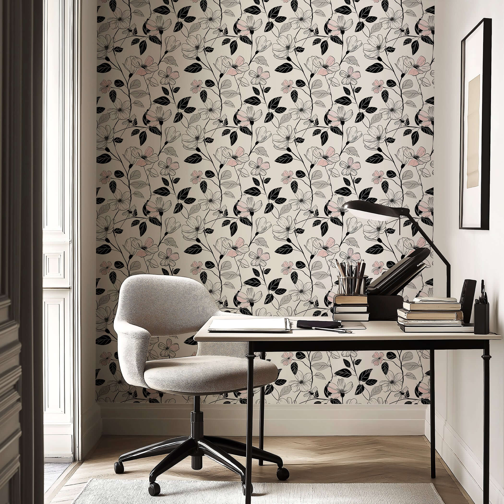 Modern floral wallpaper with soft blush blossoms and black foliage in a monochrome design, perfect for bedrooms or accent walls.