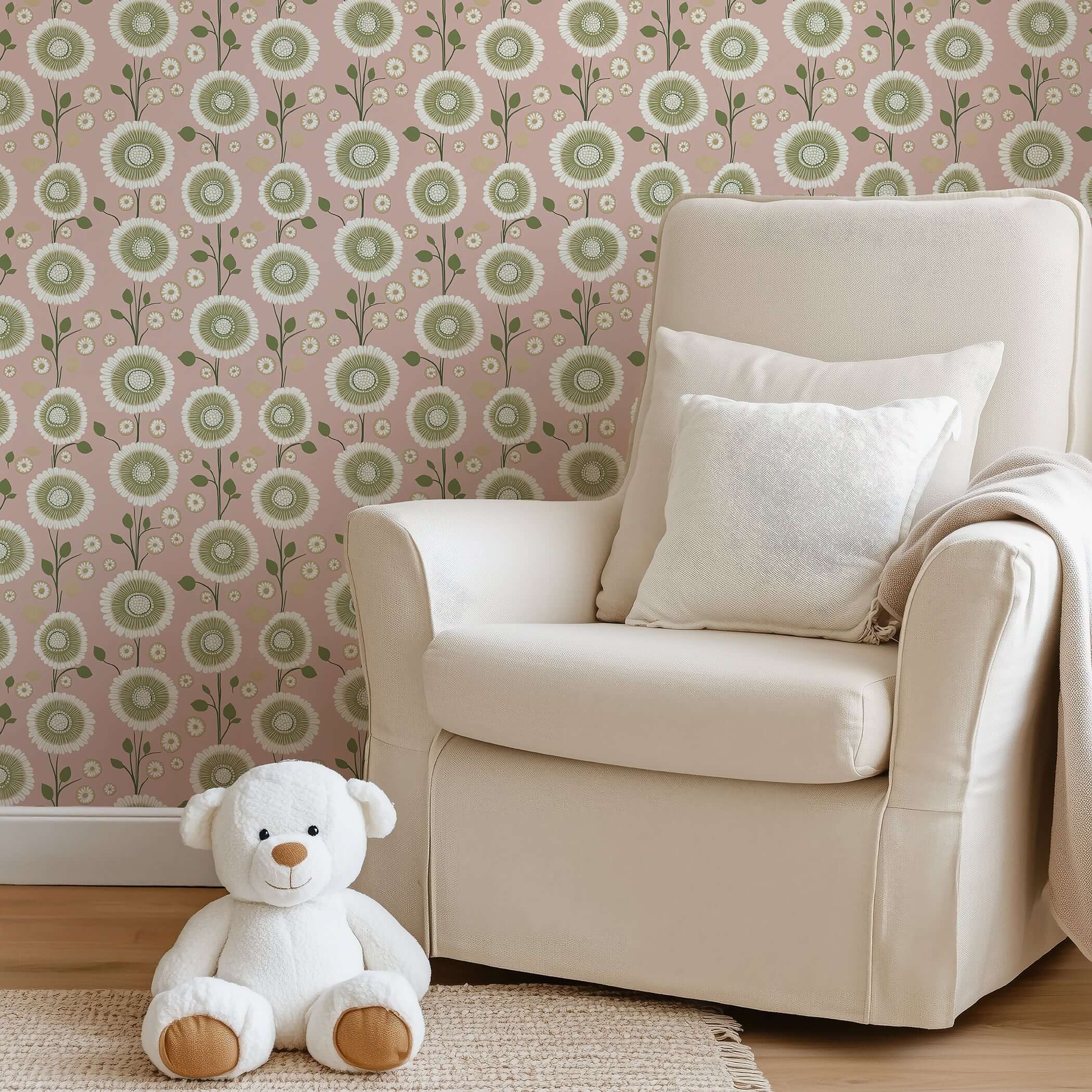 Modern floral wallpaper with olive green and white daisies on a pink background, adding charm to a cozy room with a chair and teddy bear.