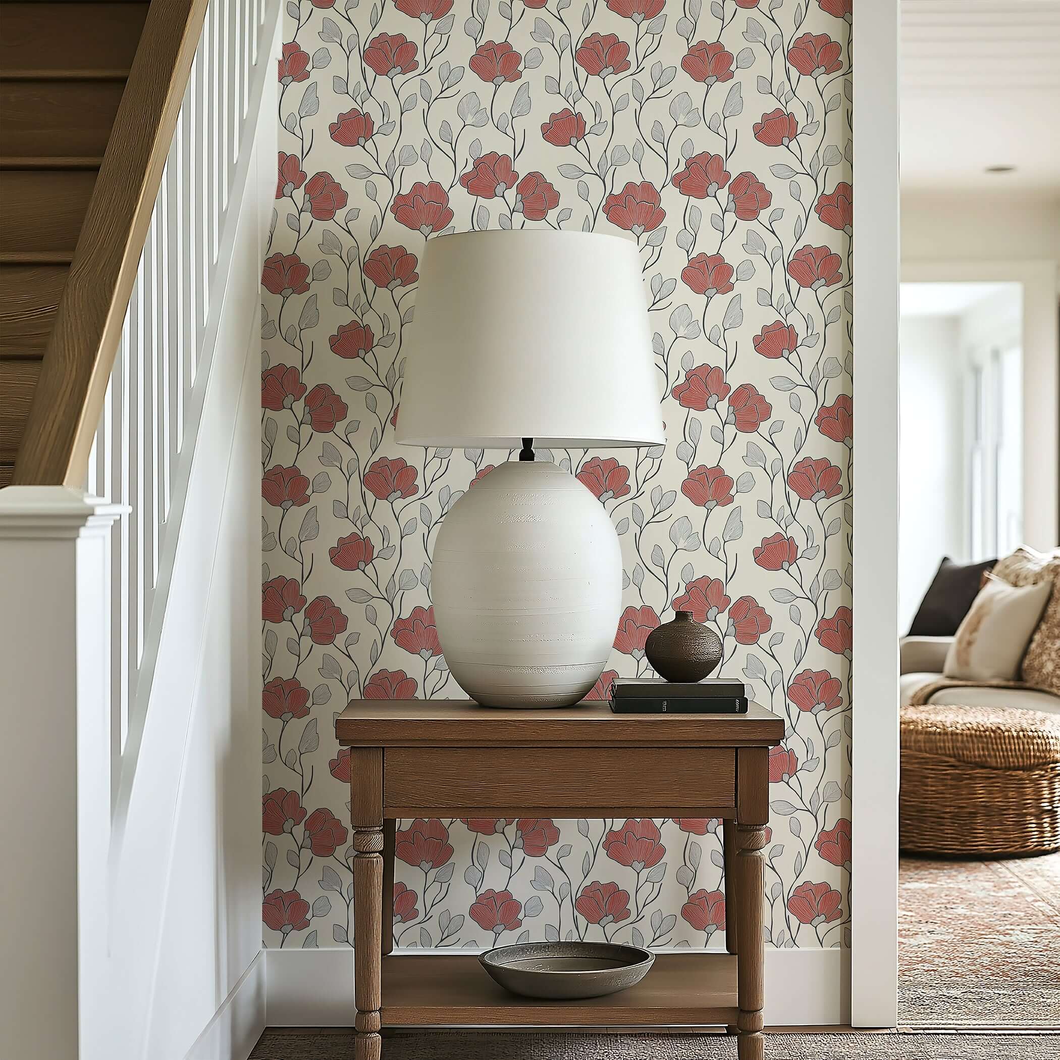 Red Petal Whimsy wallpaper with hand-drawn red florals and monochrome foliage, adding modern elegance to a cream wall behind a lamp.