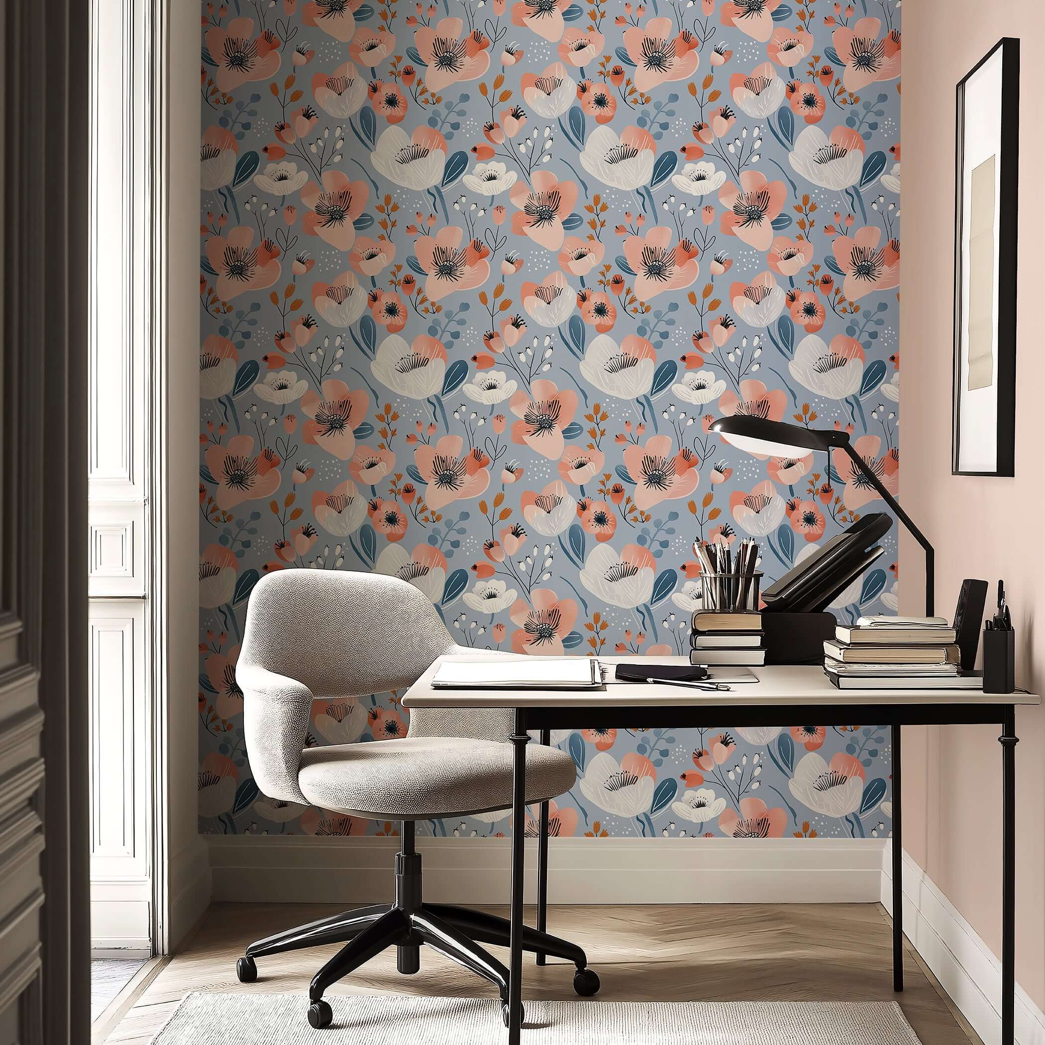 Modern floral wallpaper with coral, ivory, navy flowers on a periwinkle blue background, enhancing a stylish workspace decor.