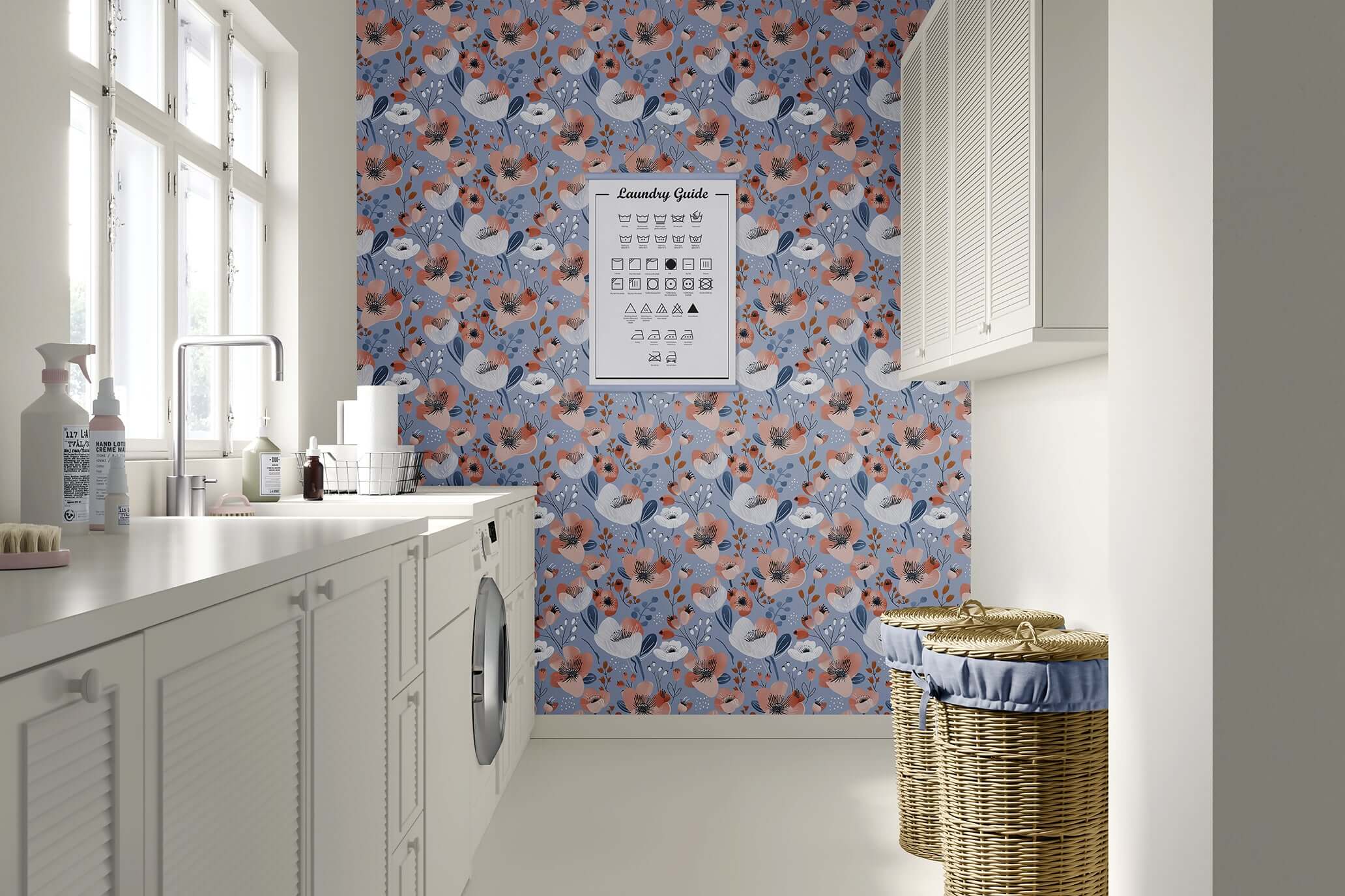 Modern laundry room with Blue Breeze Blossom wallpaper featuring floral patterns in coral, ivory, and navy on periwinkle blue.