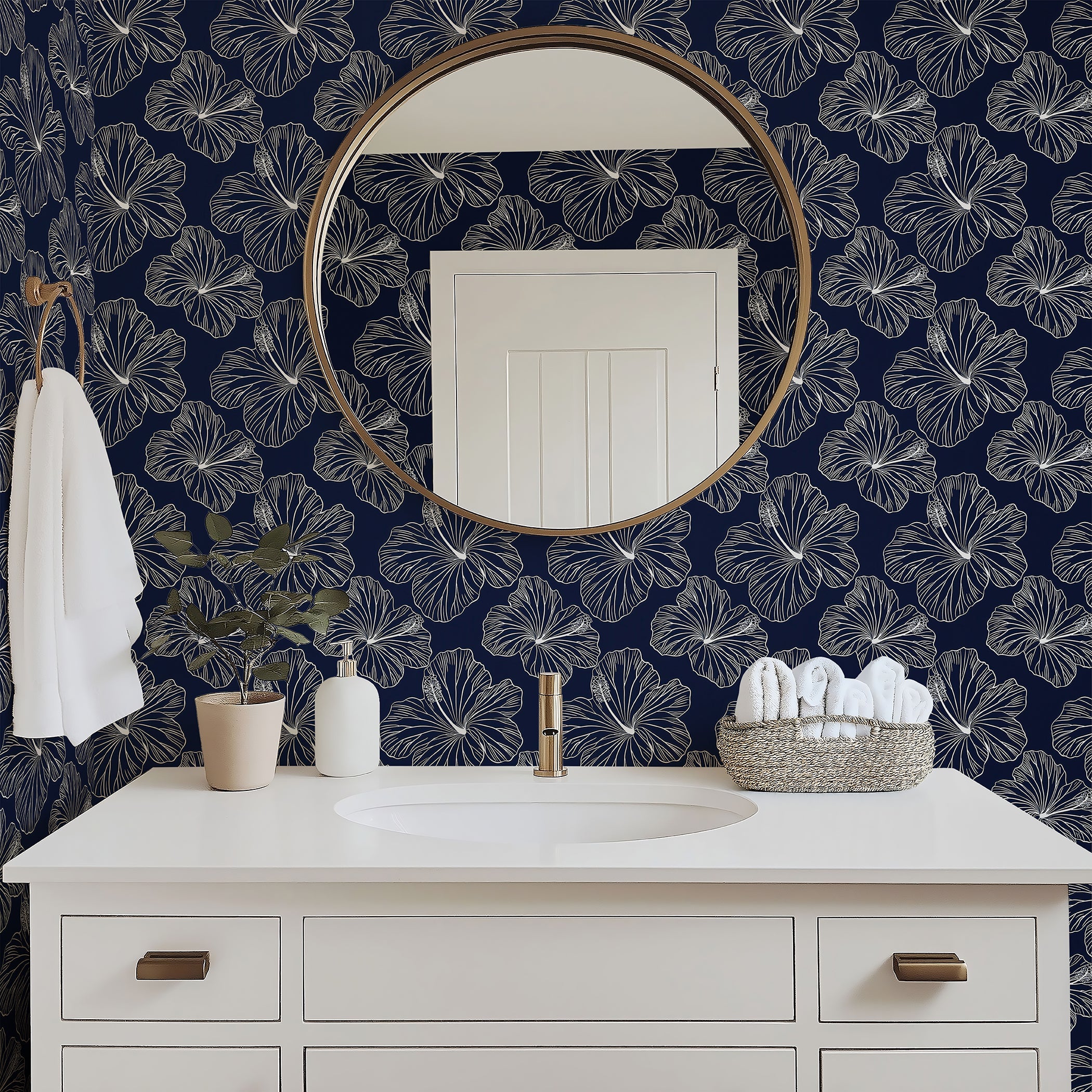 Island Nights Floral Wallpaper with white hibiscus on navy, enhancing a bathroom decor with tropical elegance and modern coastal flair.