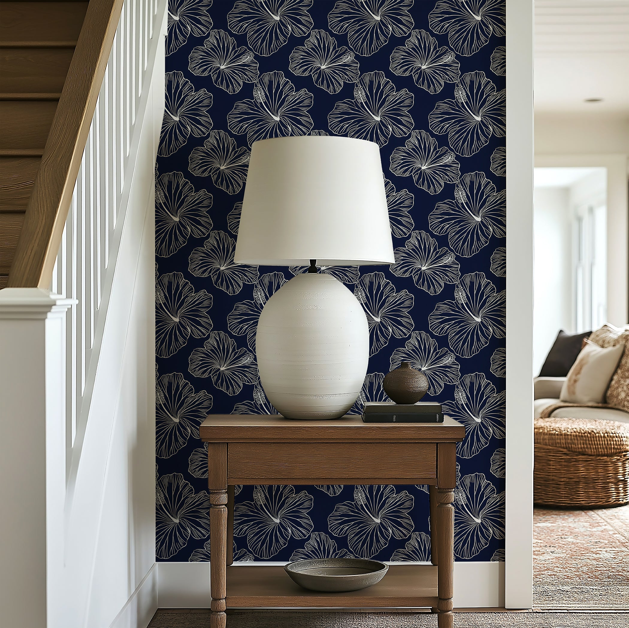 Island Nights Floral Wallpaper with hibiscus flowers on a navy background, creating a tropical coastal vibe in a home decor setting.
