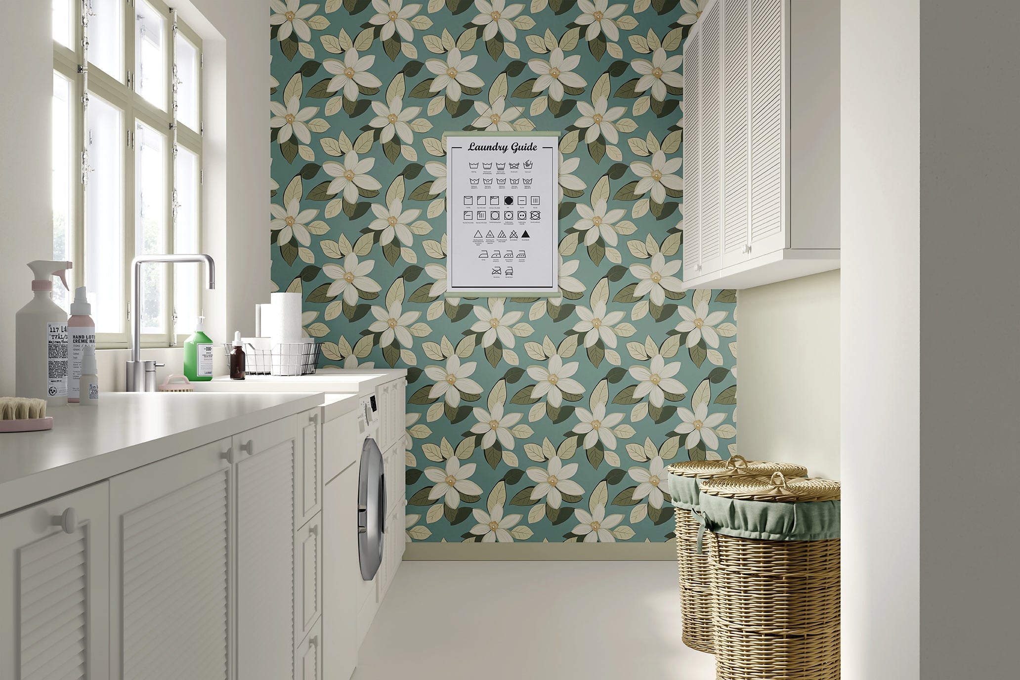 Elegant retro floral wallpaper with ivory blossoms, sage leaves, on a soft teal background in a modern laundry room.