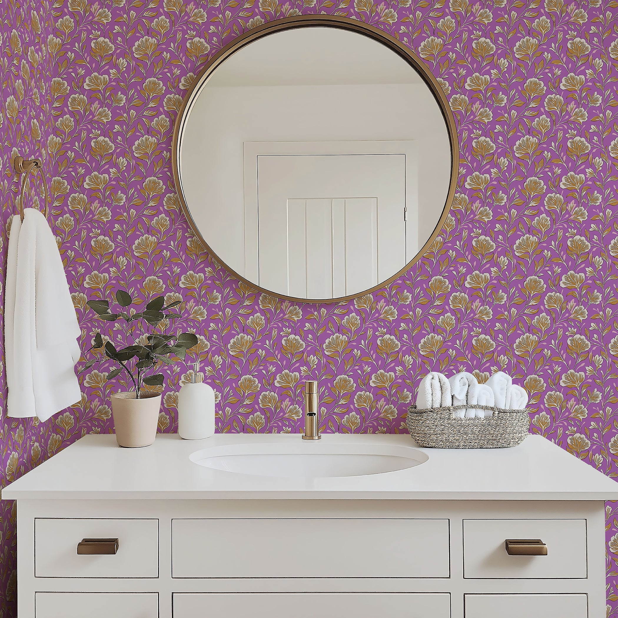 Bathroom with lilac floral wallpaper featuring golden and ivory vintage blooms, mirror, white sink, and decorative accents.