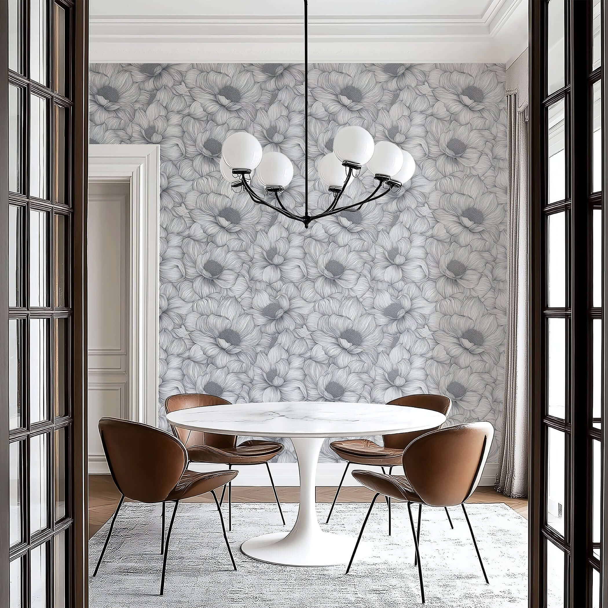Monochrome floral wallpaper in a dining room with a modern chandelier and stylish furniture, highlighting botanical elegance.