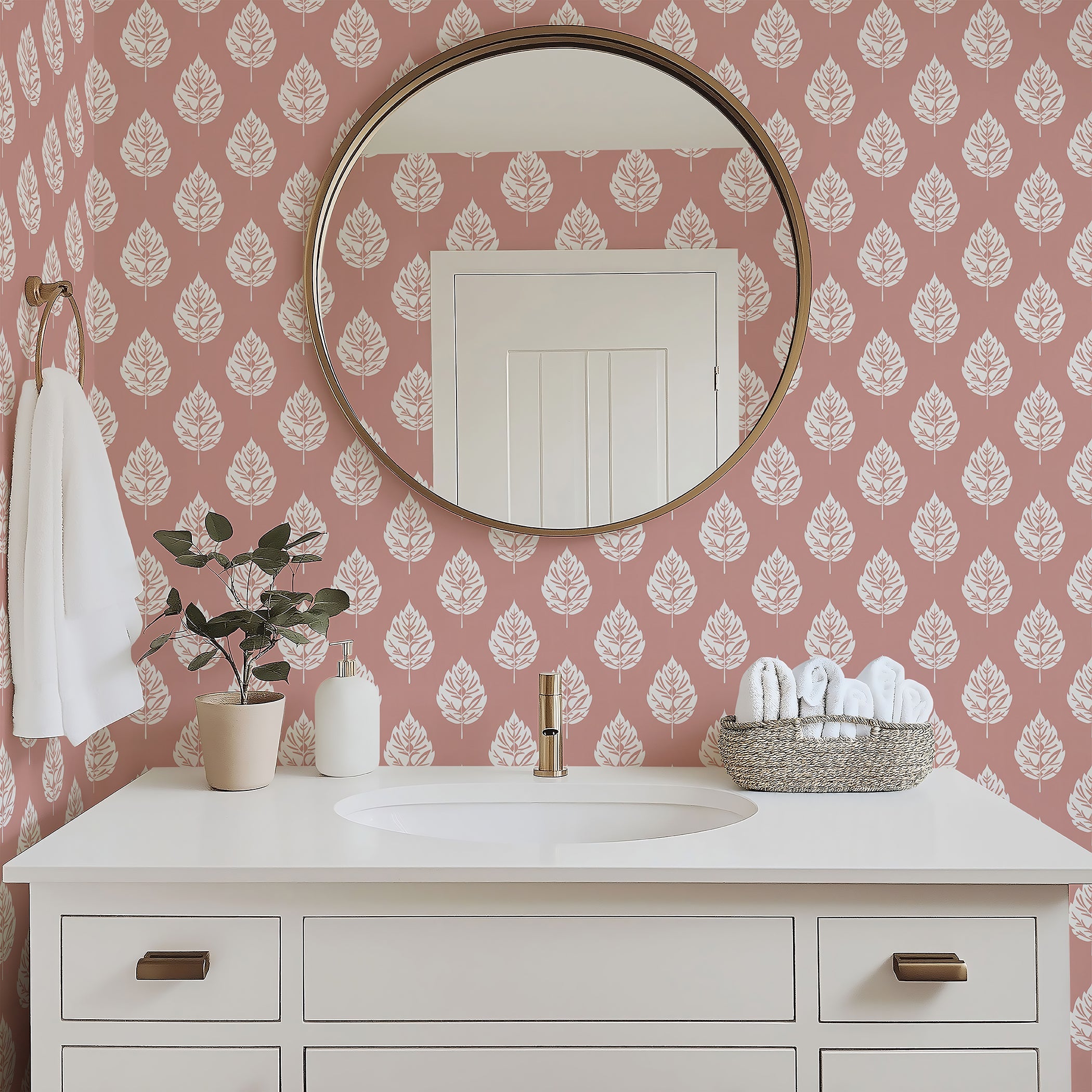 Blush Leaf wallpaper featuring white leaf patterns on a pink background, enhancing a stylish bathroom decor.