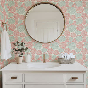 Bright bathroom featuring Dahlia Dance wallpaper in coral and mint, adding modern floral charm to the space.