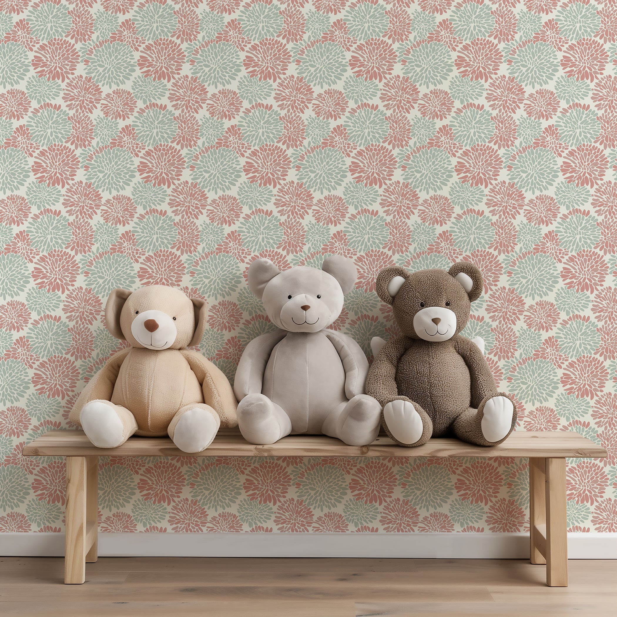 Playful Dahlia Dance wallpaper with soft coral and mint floral patterns, featuring three plush teddy bears on a bench.