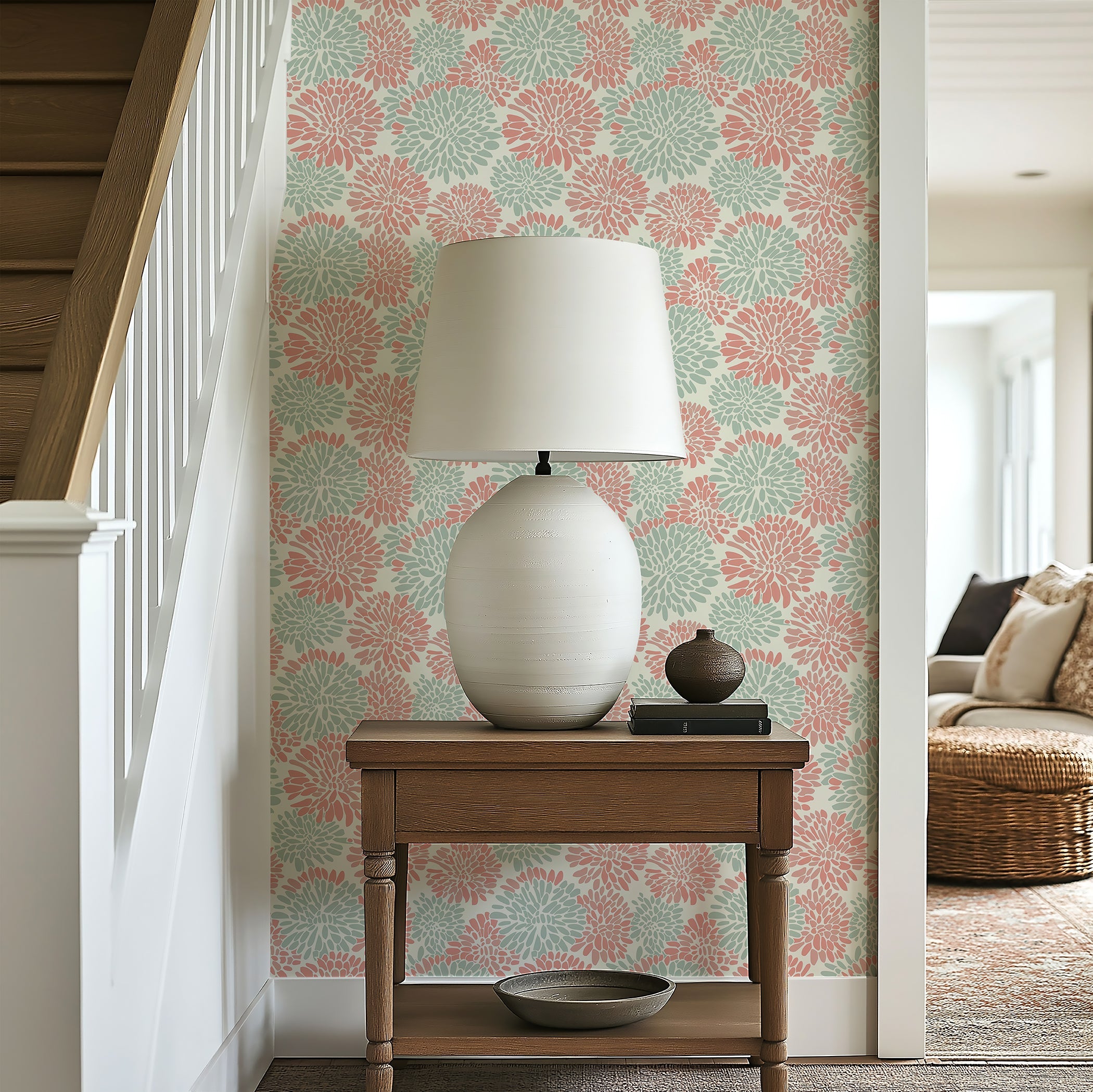 Dahlia Dance wallpaper in soft coral and mint green, enhancing a modern living space with floral patterns.