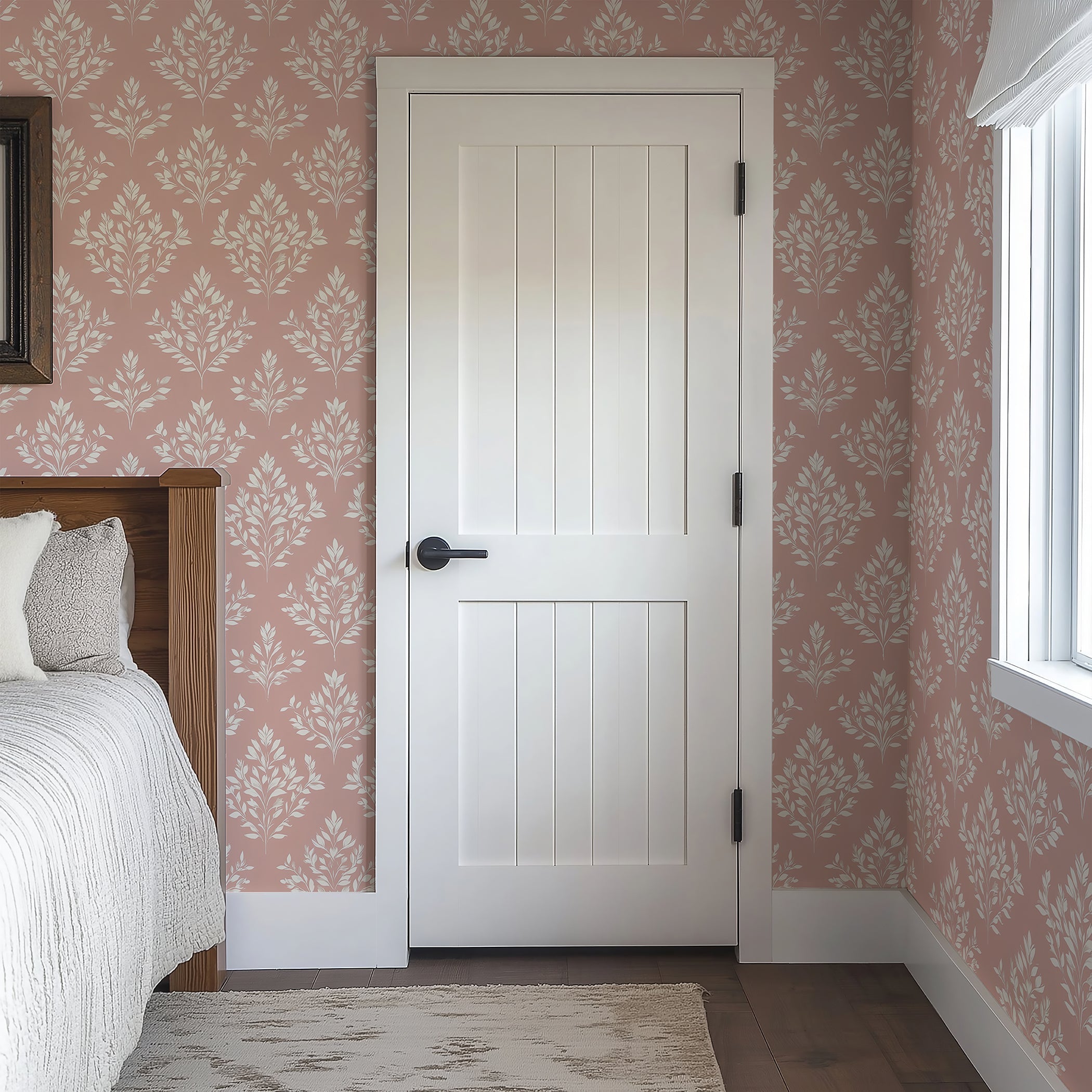 Timeless Pink Flora wallpaper in a cozy bedroom, featuring elegant floral laurels on a soft pink background.
