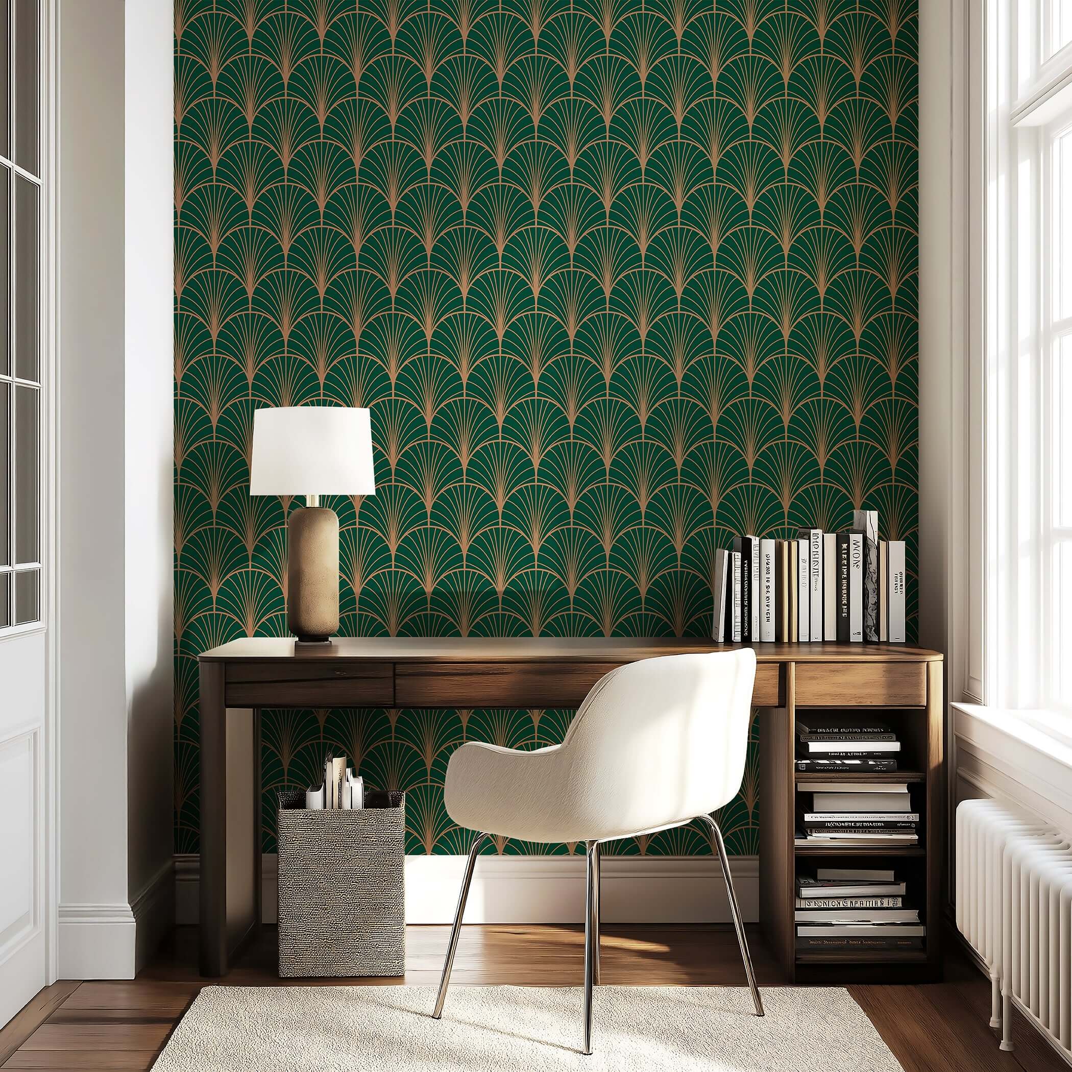 Elegant art deco geometric wallpaper in gold and emerald green enhancing a modern room with desk and chair setup.