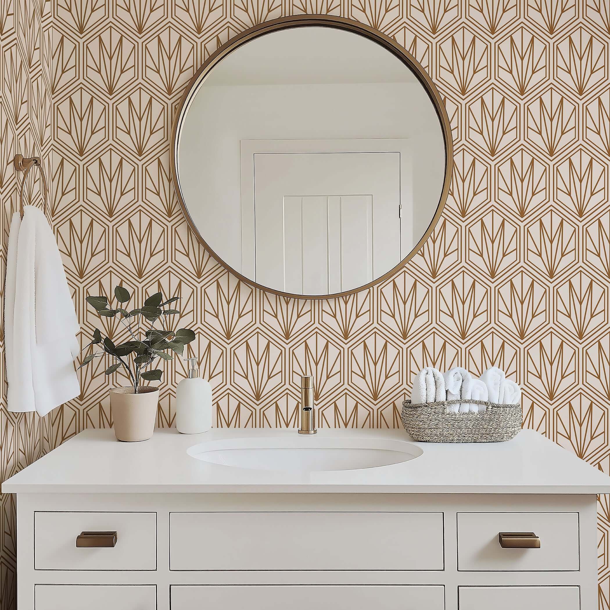 Bathroom with art deco geometric wallpaper featuring bronze hexagonal patterns and a round mirror above a white vanity.
