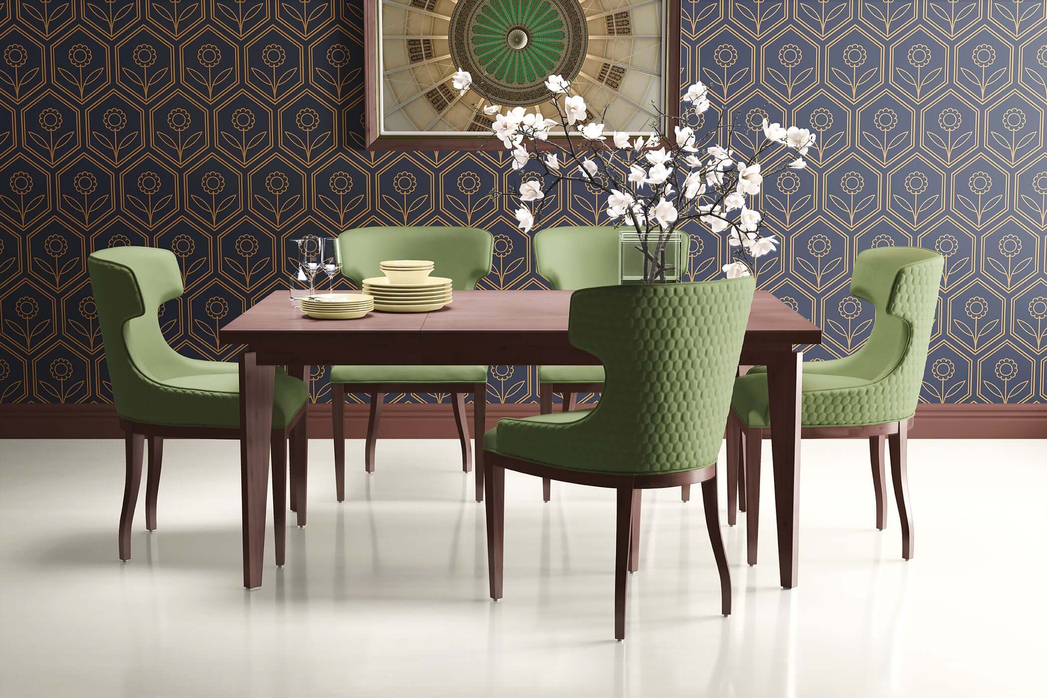 Modern dining room with wood table, green chairs, and art deco geometric wallpaper featuring a navy and gold hexagonal blossom pattern.