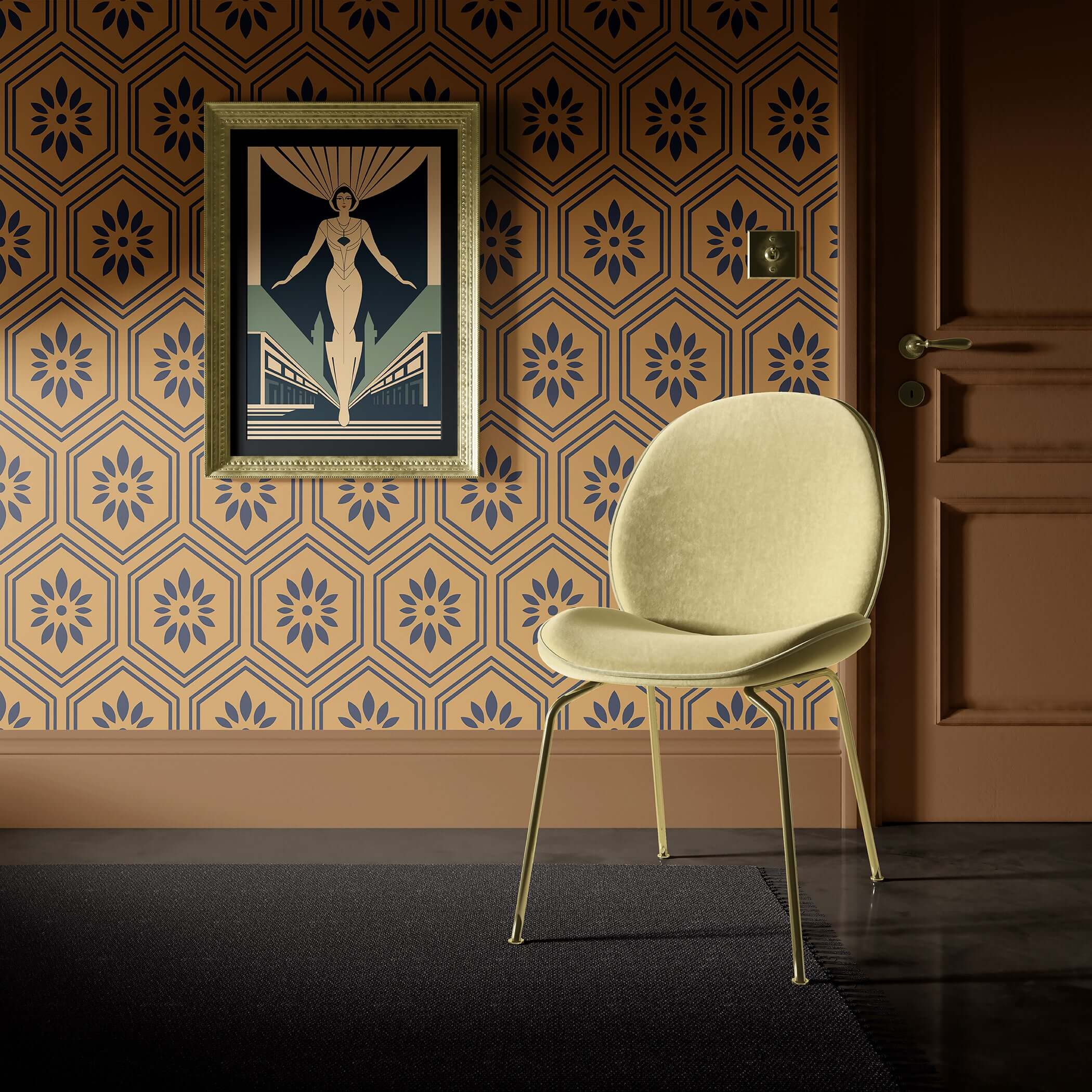 Art deco geometric wallpaper with black floral hexagons on ochre background, paired with a modern chair and framed artwork.