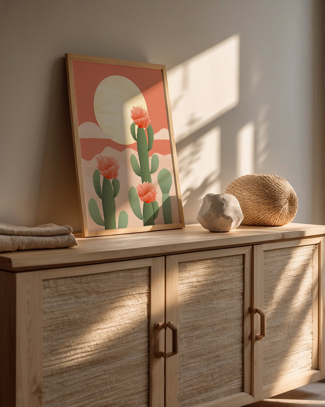 Modern wall art print of cacti flowers at sunrise in a cozy living space, showcasing bohemian design elements.