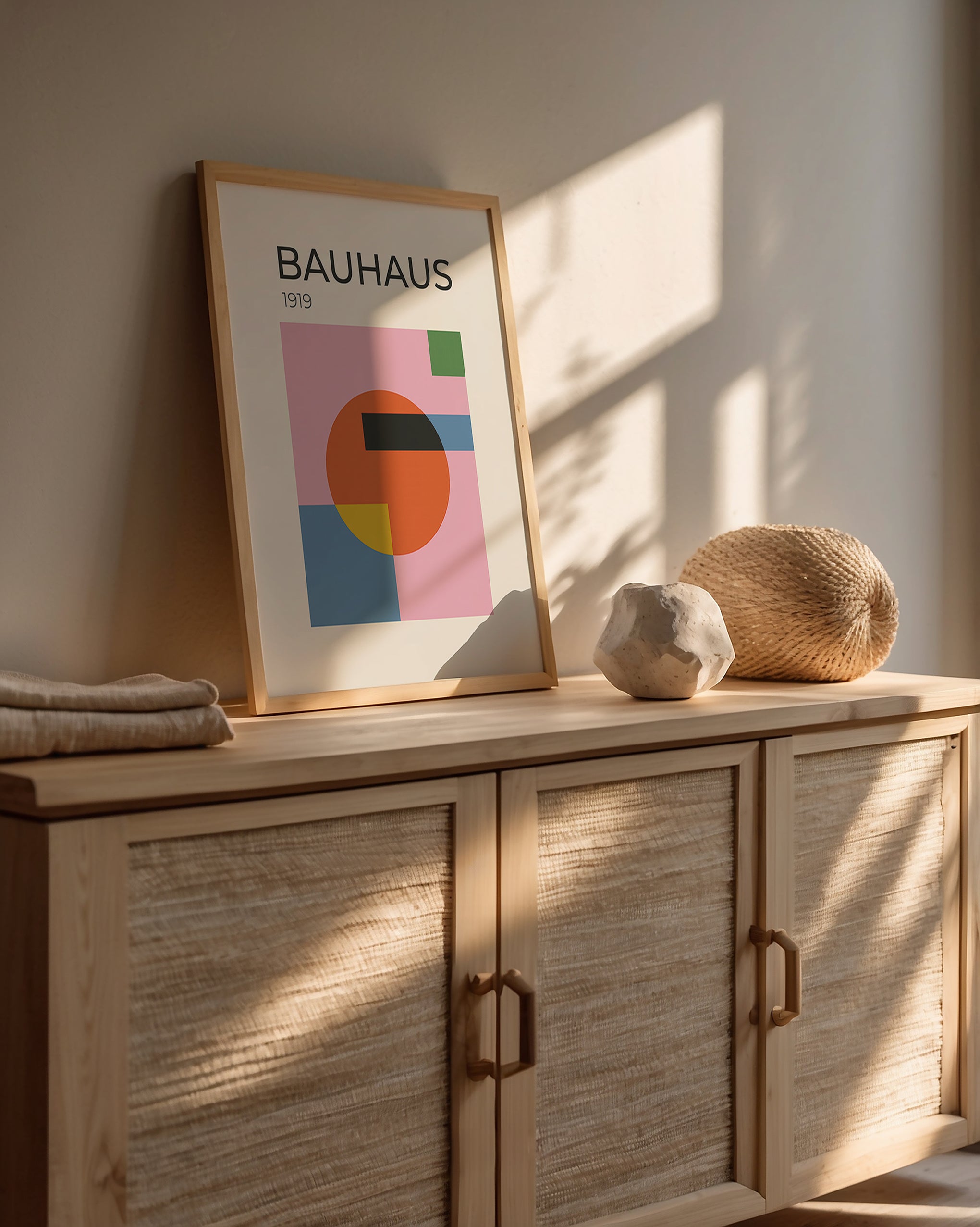 Bauhaus wall art print featuring geometric shapes and modern colors in a stylish interior setting.